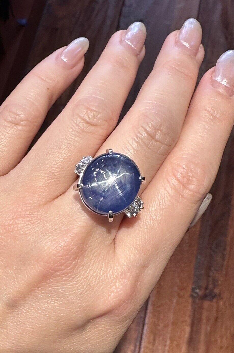 GIA Certified Unheated Blue Star Sapphire Cabochon Ring 46.90 Carat with Diamonds in Platinum 

Blue Star Sapphire Ring features a 46.90 Carat Natural Blue Star Sapphire Cabochon accented by two square cut diamonds on each side set in Platinum.

The