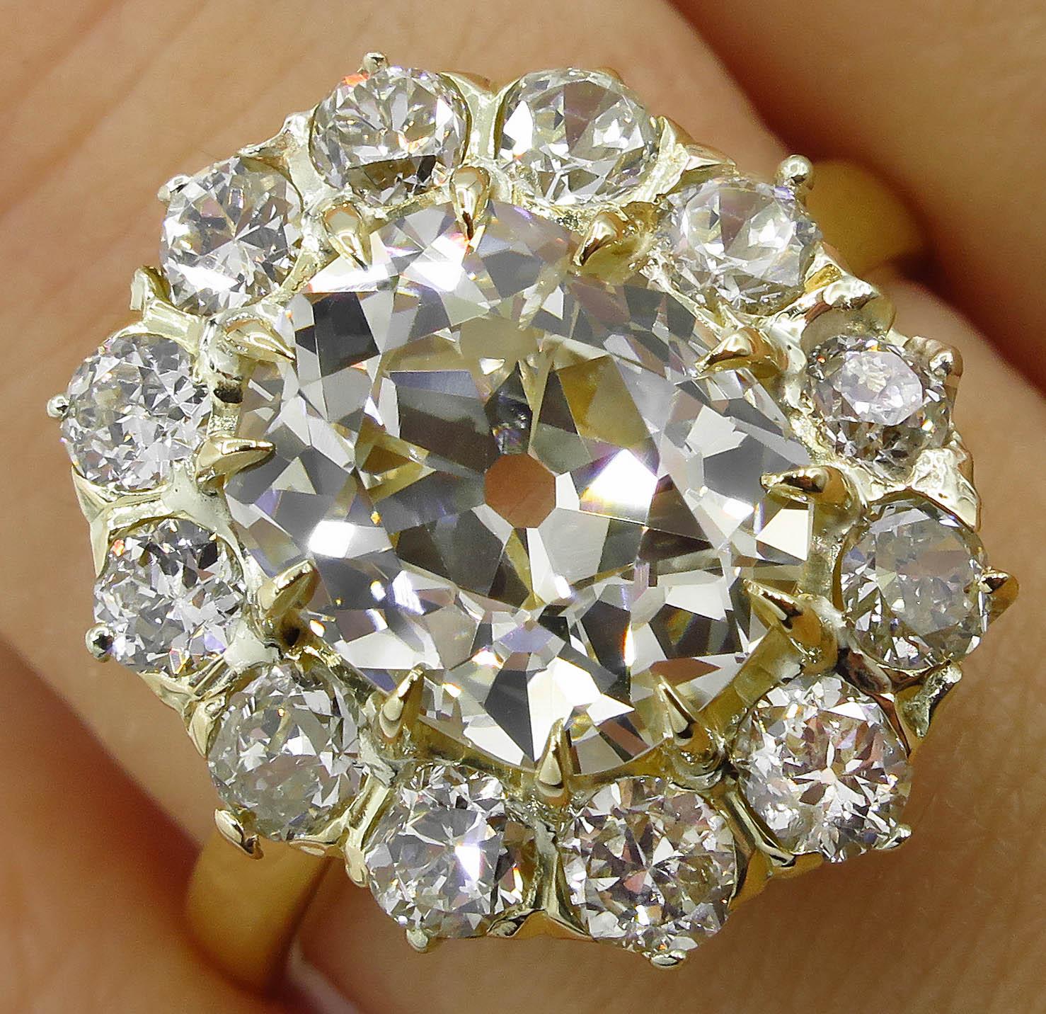 A RARE Authentic Antique Victorian CIRCA 1890s Handmade 18k Yellow Gold (stamped) Cluster Engagement Ring dazzles with GIA Certified 3.32ct Old Mine Cushion Center Diamond in N color I1 clarity; with measurements of 9.65x8.10x5.63mm- HUGE! GIA