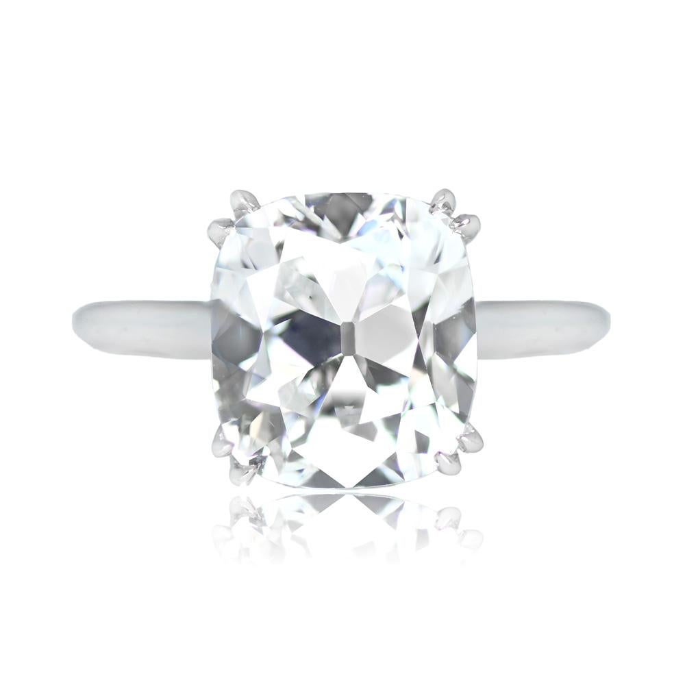 This elegant diamond solitaire ring showcases a GIA-certified antique cushion-cut diamond with exceptional specifications: D color, VS1 clarity, and a substantial weight of 4.75 carats. The diamond is securely set in a double-pronged platinum