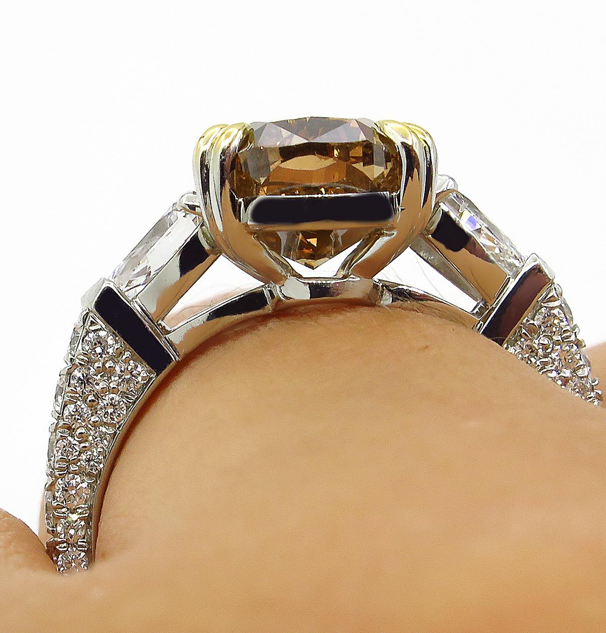 GIA 4.85 Carat Natural Fancy Brown Orange Oval Cut Diamond 3-Stone Platinum Ring 9