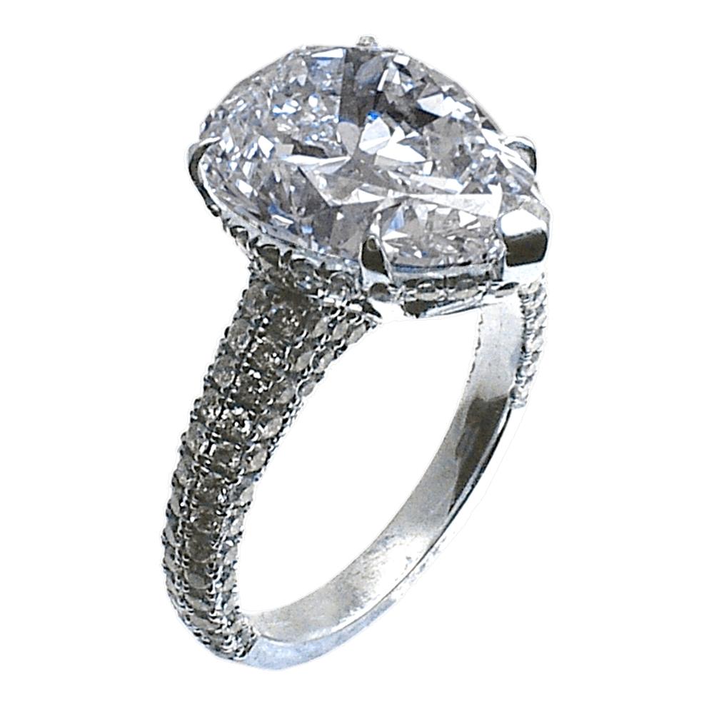 A very nice & shiny 4.86 Ct Pear Shape F/SI2 GIA certified center Diamond set in a beautiful hand crafted 18K White Gold Pave set Engagement Ring with a hidden Halo. Total diamond weight of 0.96 Ct. on the ring. 

Diamond specs:
Center stone: 4.86