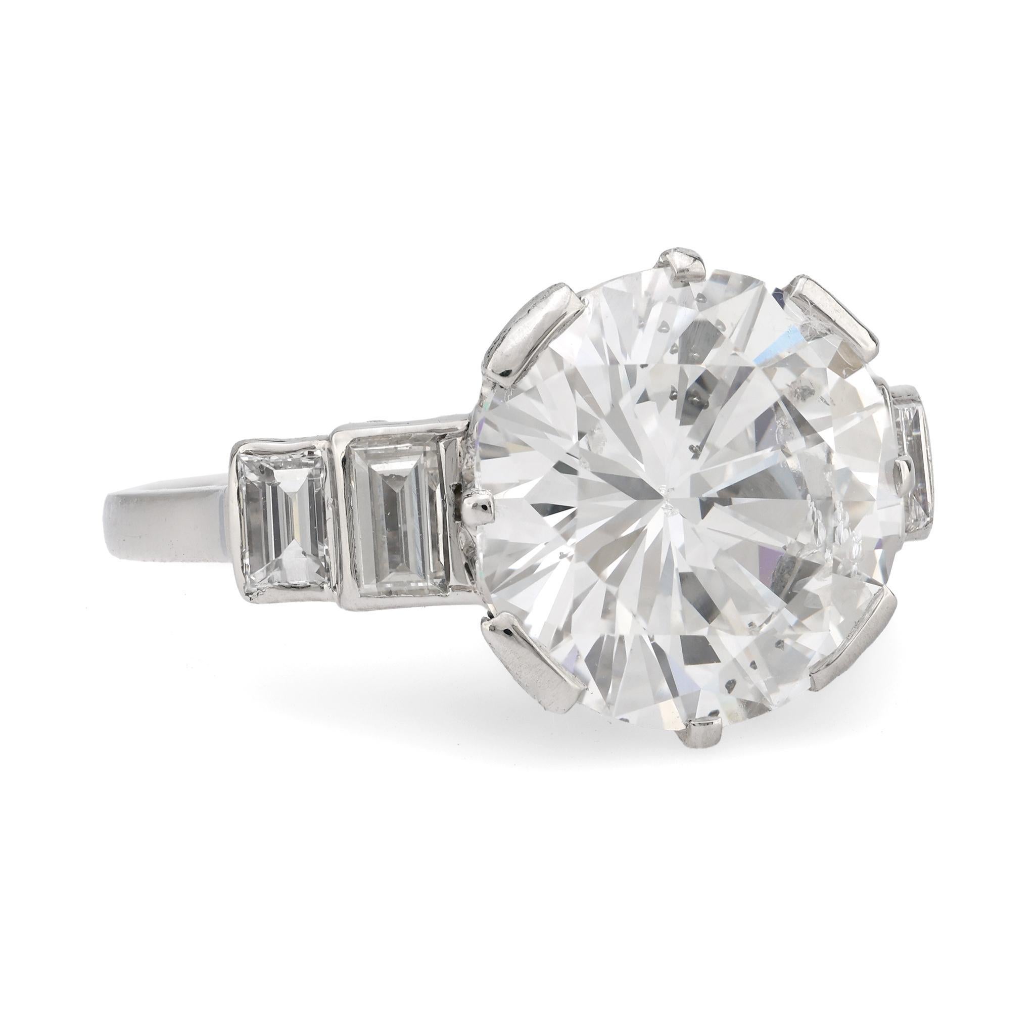 Modern GIA 5.02 carat round brilliant cut diamond platinum engagement ring