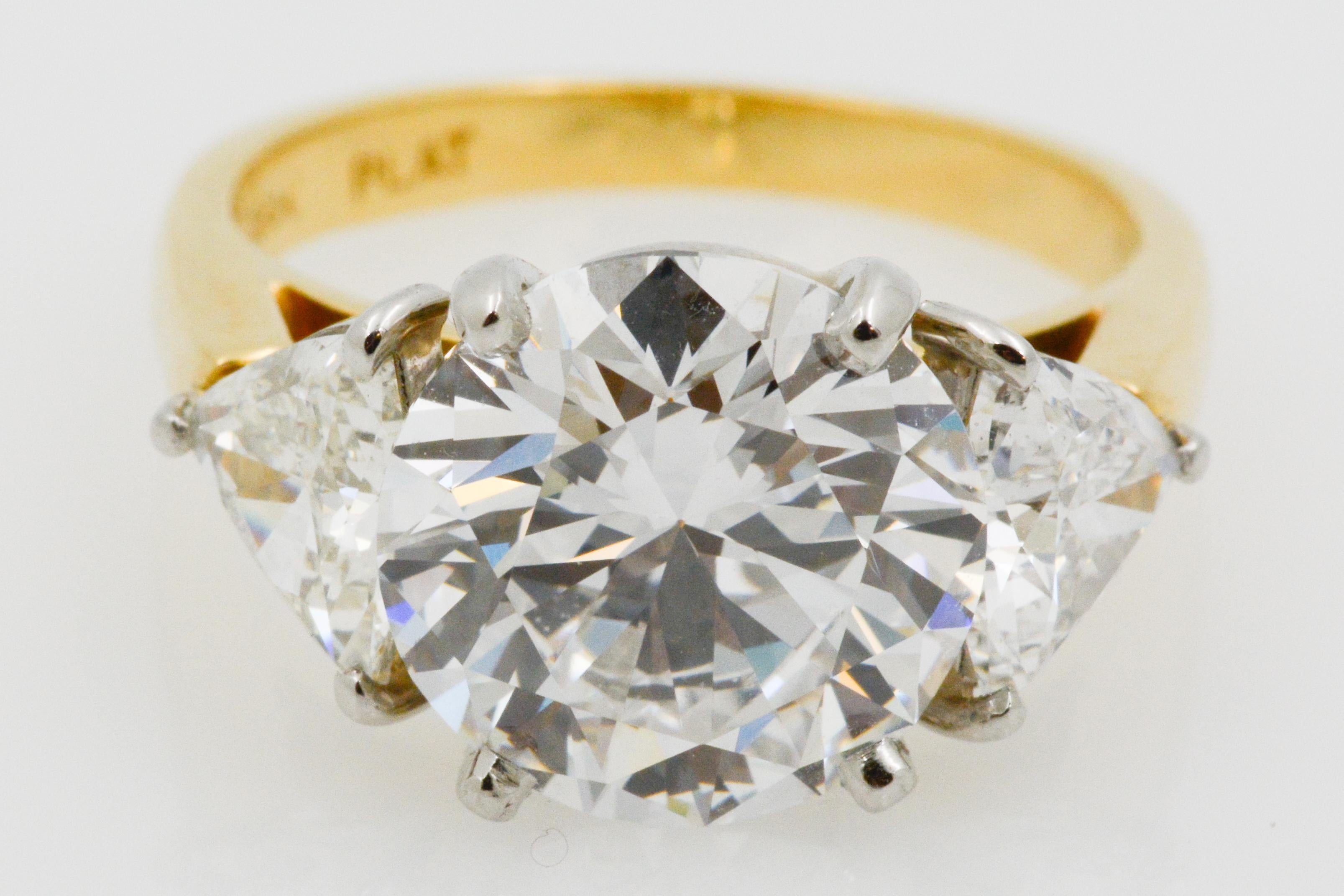 GIA 5.02 Carat Three-Stone 18 Karat Yellow Gold and Platinum Ring In Good Condition In Dallas, TX