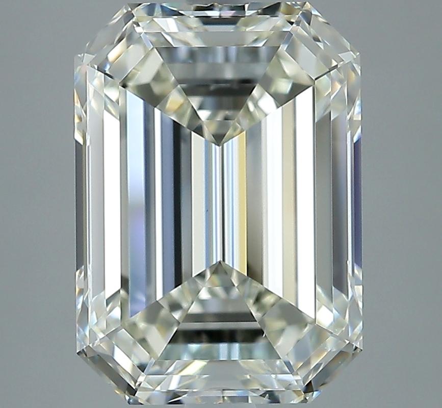 Elegantly designed, this stunning diamond ring captivates with its remarkable features. At the heart of this piece lies a breathtaking emerald K VS2 5.02 diamond, securely held in a raised prong setting that enhances its brilliance and fire. The