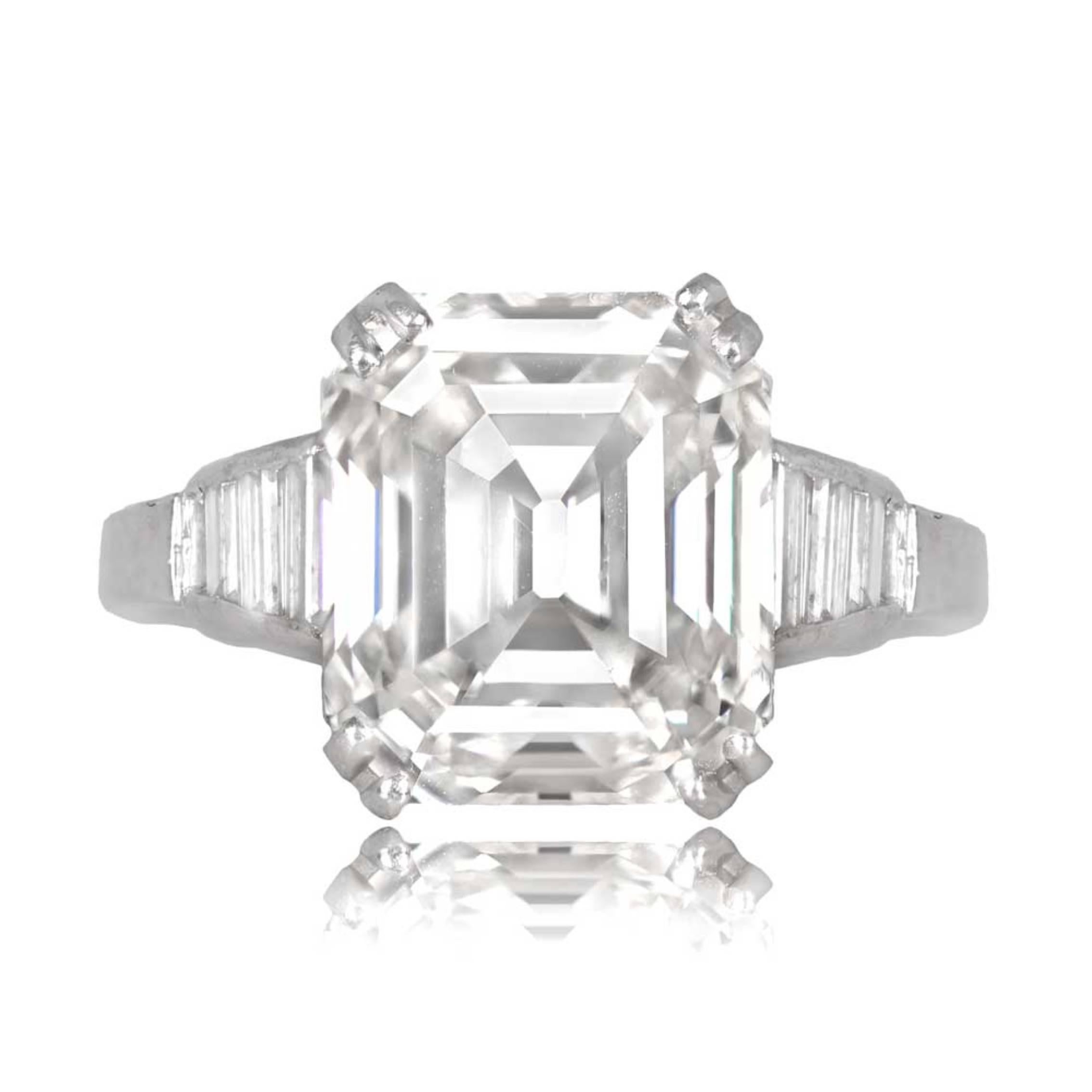 A platinum engagement ring with a GIA-certified 5.05-carat emerald-cut diamond (I color, VS1 clarity) set in prongs, accented by calibrated baguette-cut diamonds on the shoulders.

Ring Size: 6.5 US, Resizable
Certification: GIA Certificate
Color: I