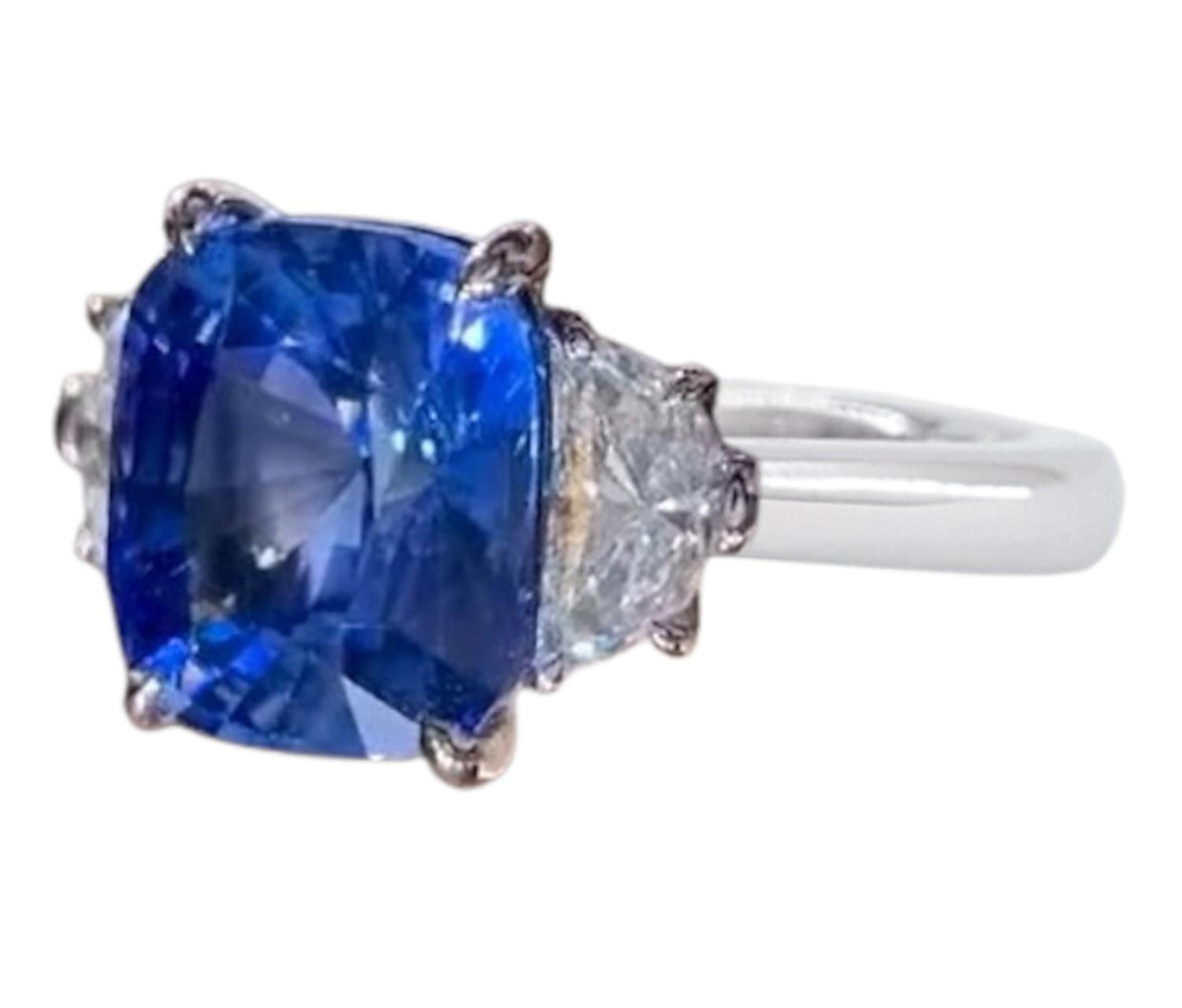  gorgeous and substantial 5.28 GII certified sapphire has vibrant blue color and a stunning play of light! It is a brightly saturated and perfectly even classic Ceylon blue color that GII classified simply as Blue. 