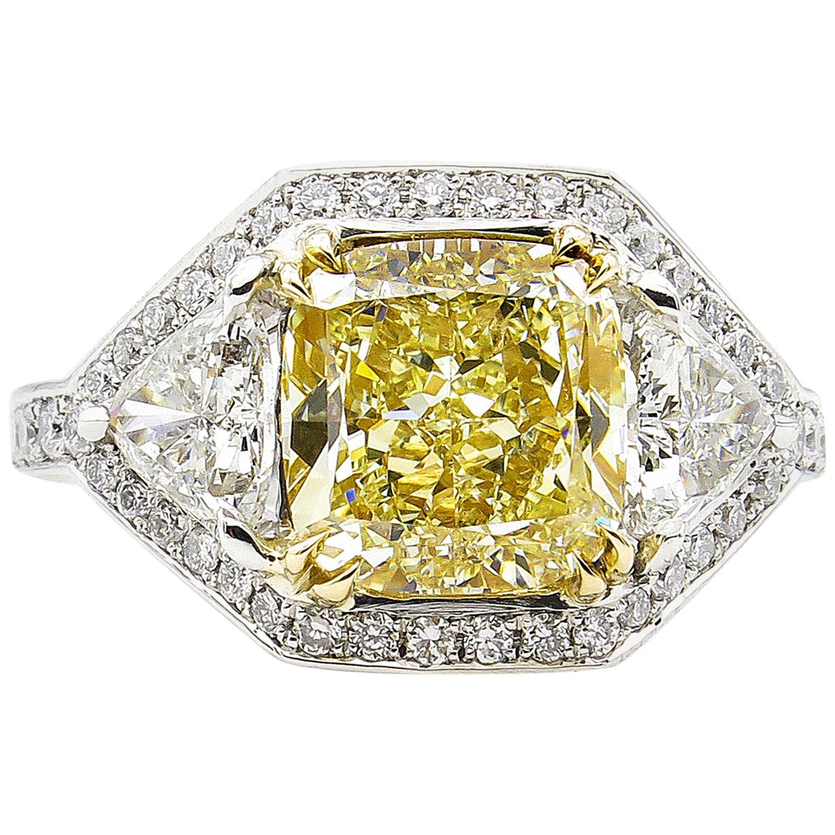 GIA 5.10 Carat Fancy Yellow Cushion Diamond 3-Stone Engagement Ring Platinum