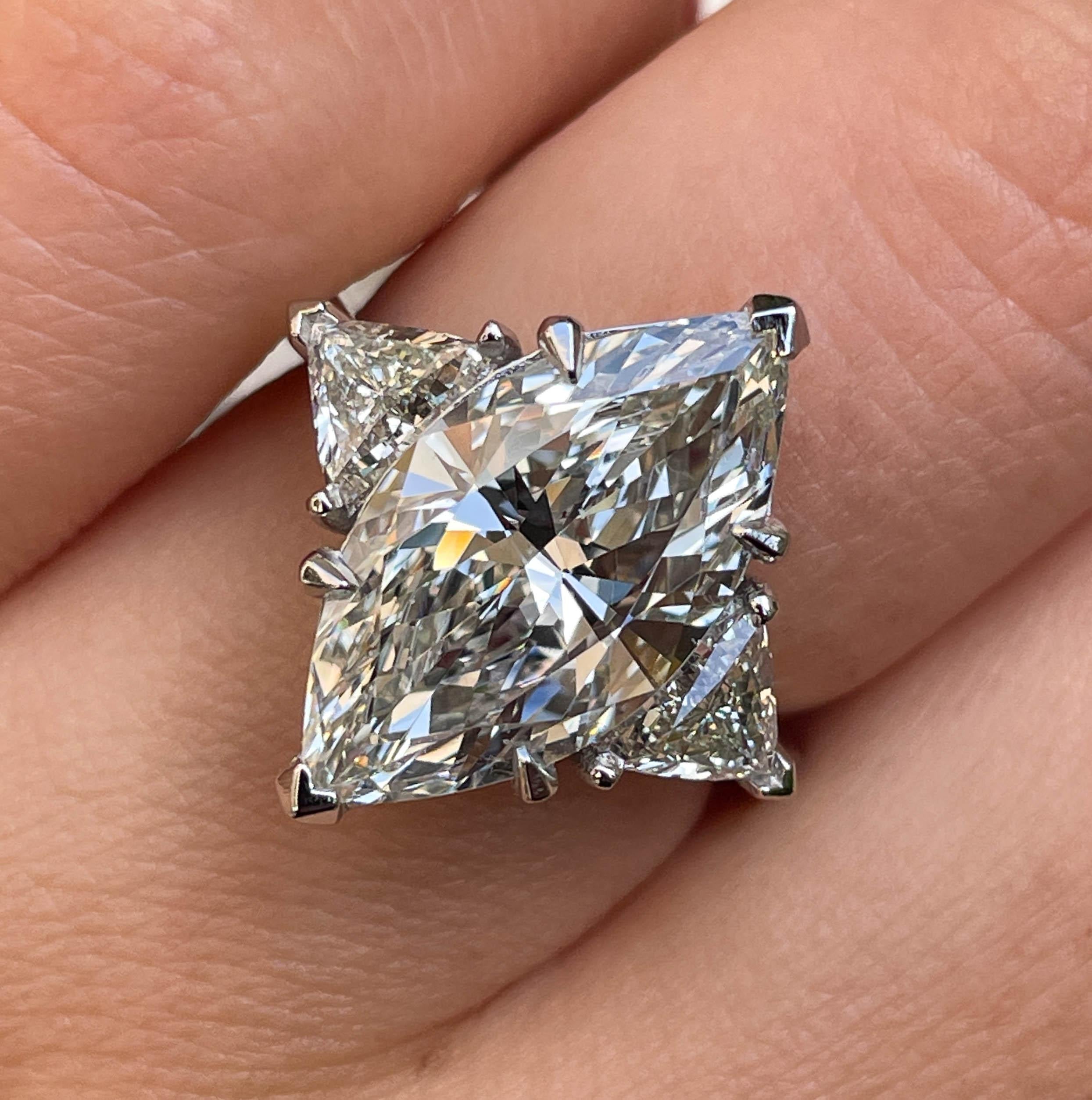 An Amazing HUGE Estate Vintage Diamond Engagement ring in Platinum (stamped) with GIA Certified 4.35ct Marquise Center Diamond in M color VS2 clarity (Appears Warm White and Very Clear). The Measurements of the Diamond are 17.45X8.84X5.42mm. GIA