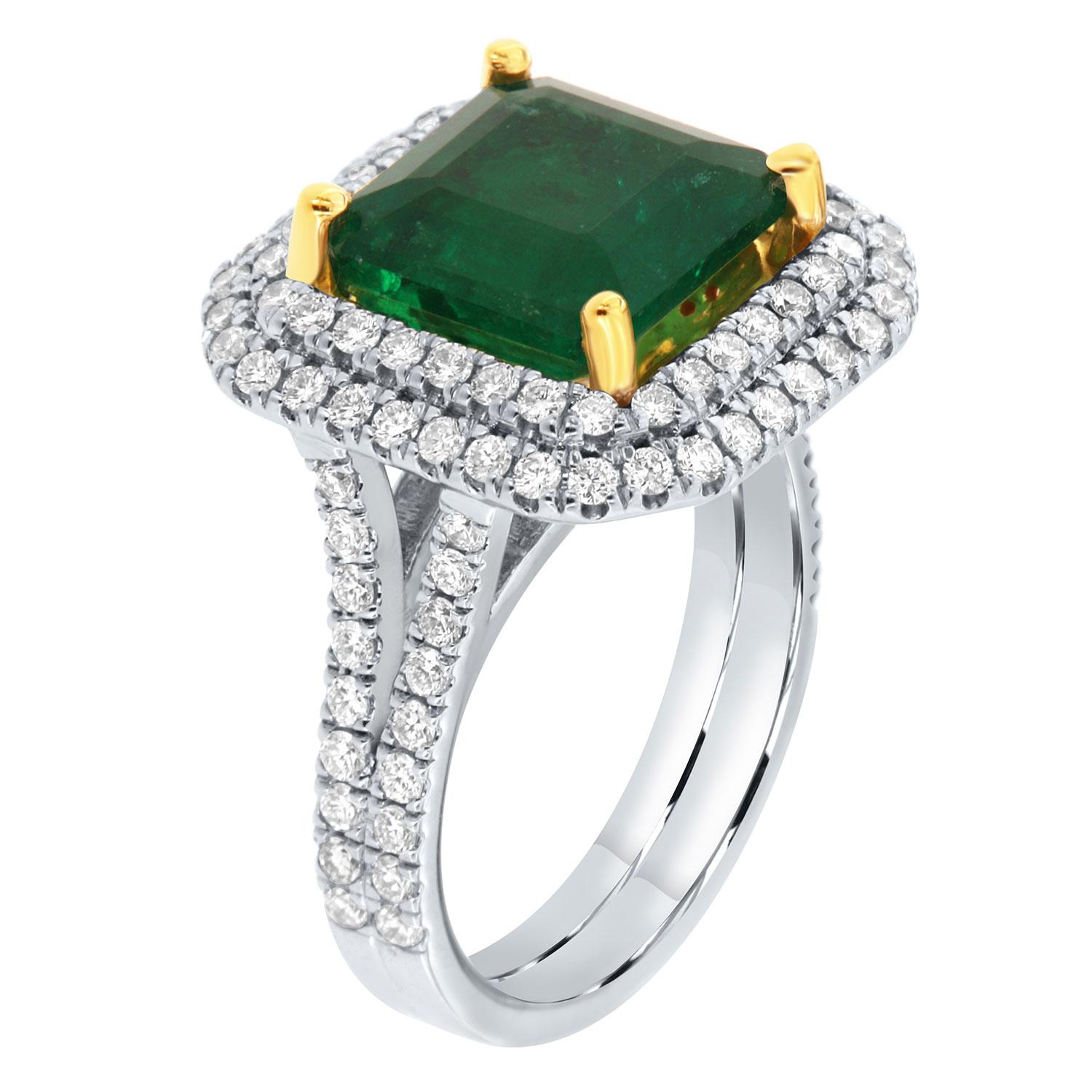 This 14K White and Yellow gold ring feature a 5.20 - Carat Asscher cut Natural Green Emerald from Zambia in a bright green color. The emerald is encircled by a double halo of brilliant round diamonds on a two rows split shank 3.7mm wide band. The