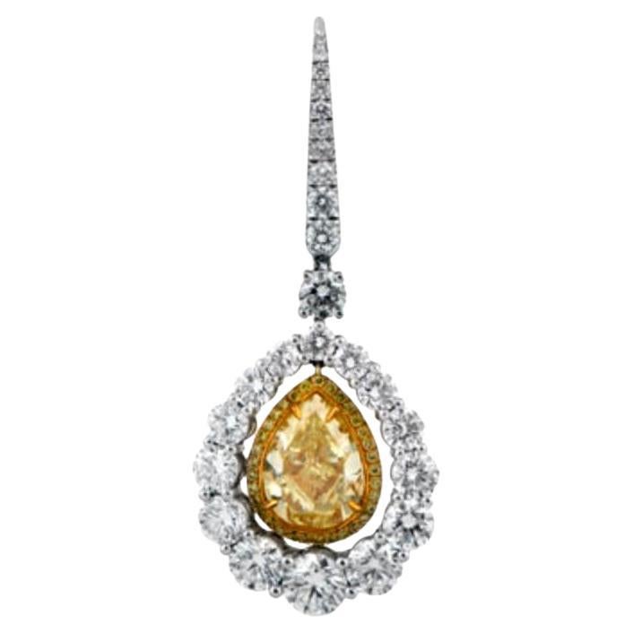Indulge in the enchanting elegance of these exquisite Fancy Yellow Diamond Earrings, where luxury meets beauty. Each earring showcases a mesmerizing pear-shaped yellow diamond, with a combined weight of 5.35 carats, radiating brilliance within the