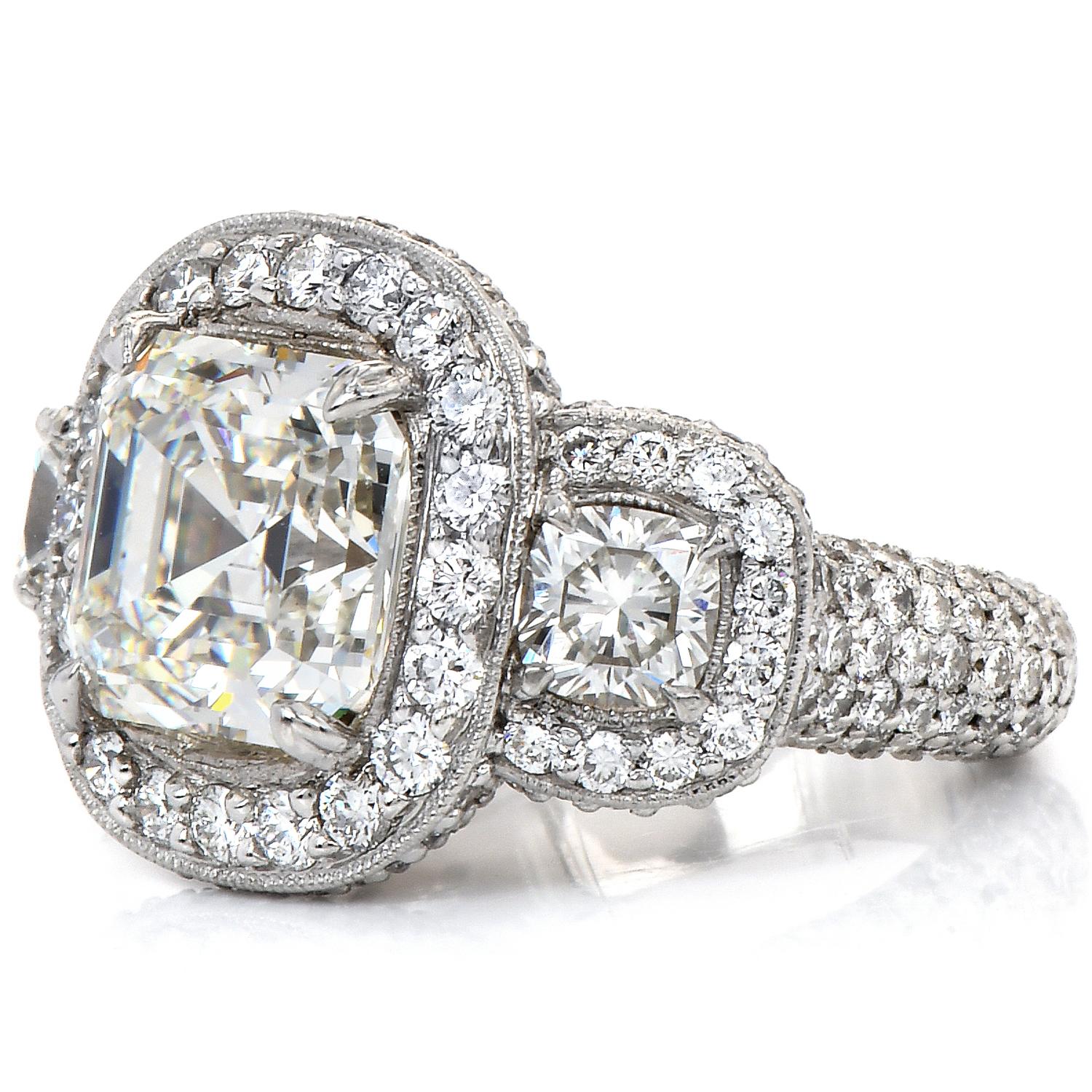 Art Deco GIA 5.49ct Asscher Cut Diamond Platinum Halo Triple Stone Engagement Ring For Sale