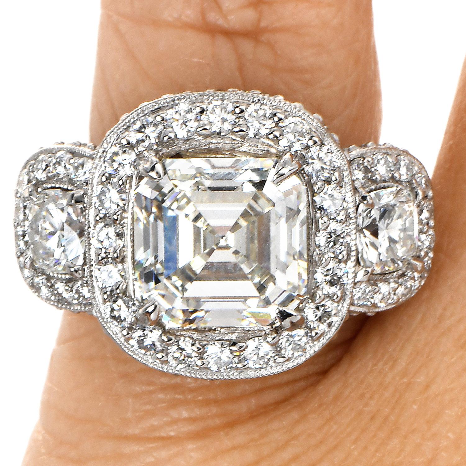 GIA 5.49ct Asscher Cut Diamond Platinum Halo Triple Stone Engagement Ring For Sale 3