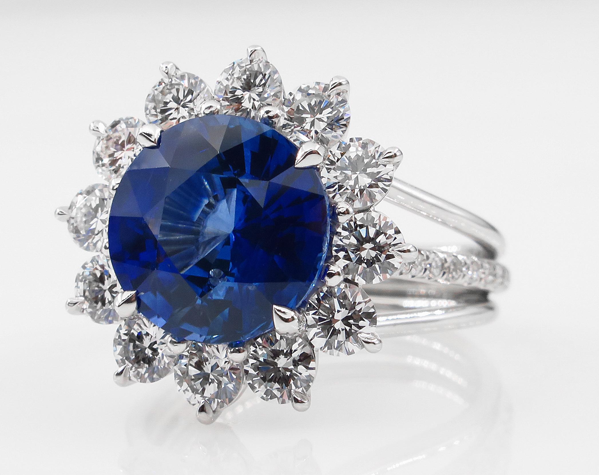 An Iconic Style and VERY ELEGANT Ceylon Natural Gorgeous Deep Blue Sapphire & Diamond Cluster Ring.
One of the most recognized design, the Round cut Center Sapphire is 4.32ct, measures 9.86x 10.01x 5.85mm. Certified by GIA with Sri Lanka ( Ceylon)