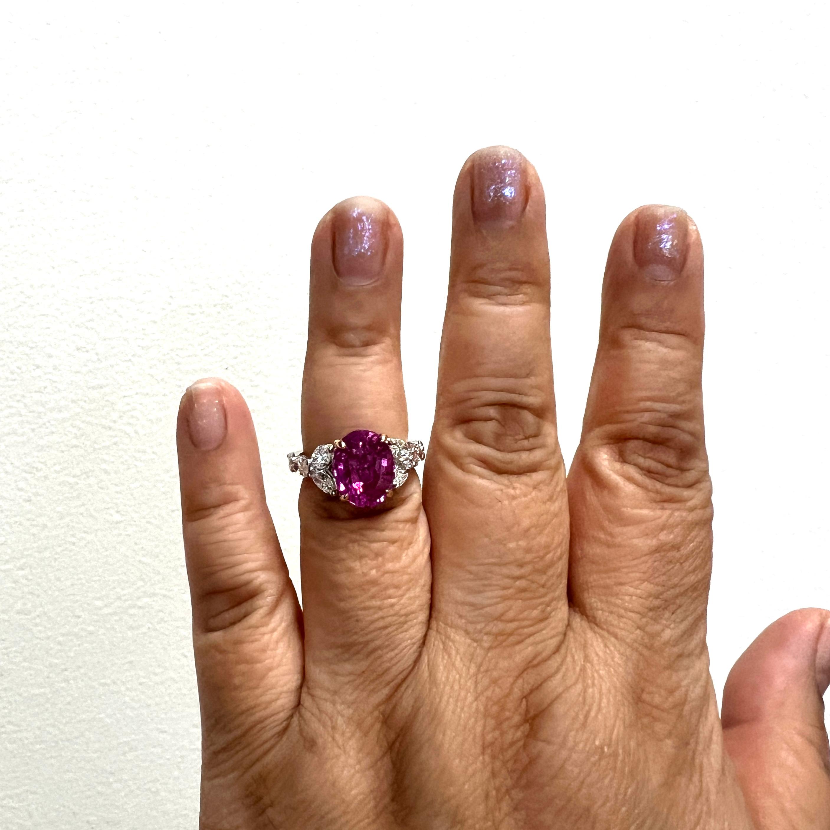 Gorgeous 6.05 ct. pink sapphire oval with 2.08 ct. good quality white diamond.  Handmade in 18k white and rose gold.  Ring size 6.75.  Comes with a GIA certificate.
