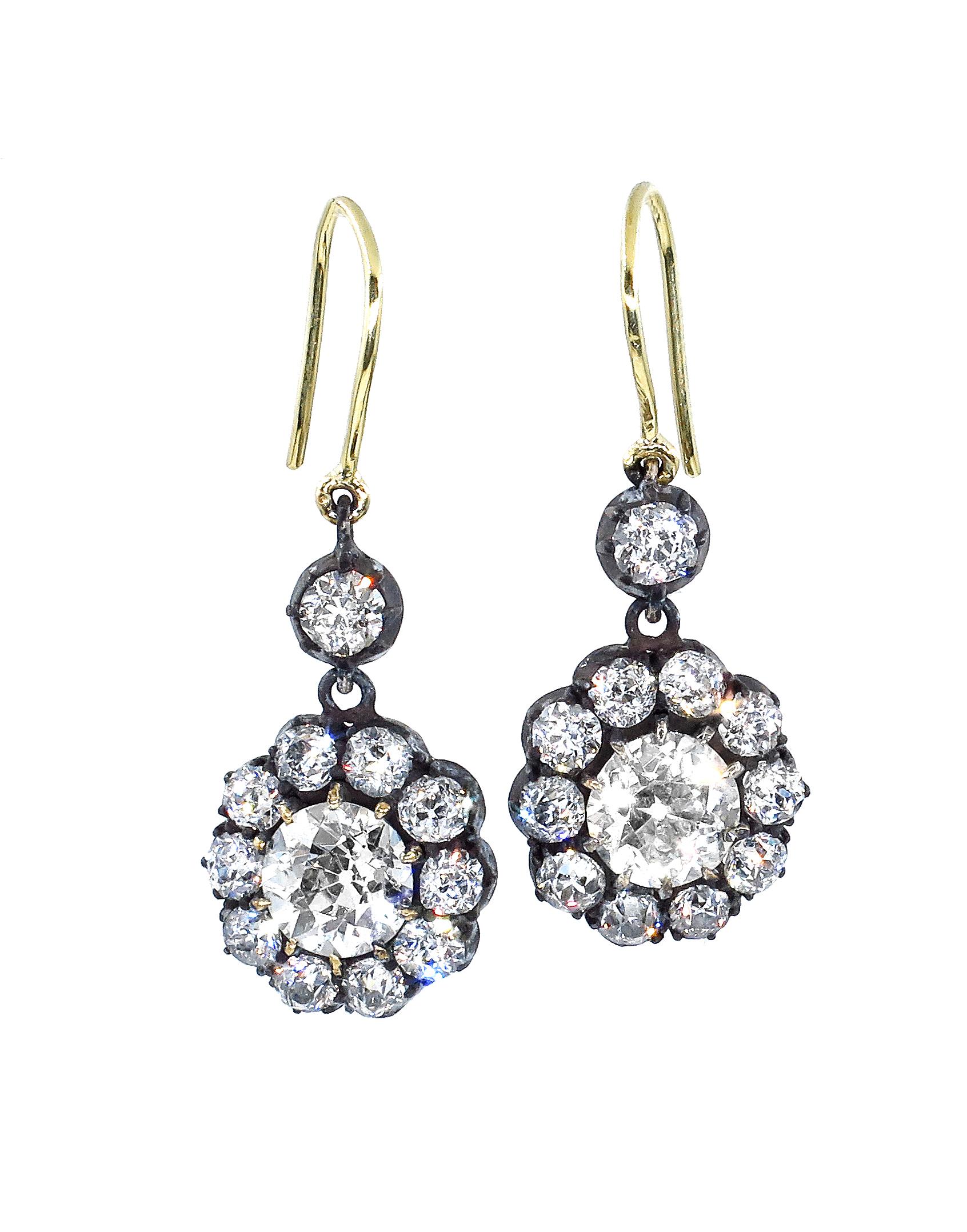 Unique and Exquisite pair of Original Early Victorian Era 18k Gold ( tested ), and oxidize blackened silver top (as all the diamonds were set back in the day to bring out the brilliance) Earrings with shimmering Old Mine cut Diamonds.
Circa 1840s,
