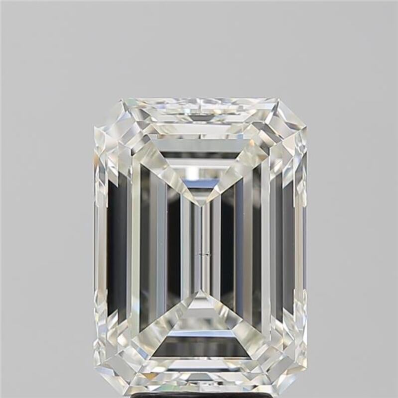 This sophisticated diamond ring features a striking centerpiece of a emerald diamond, weighing 6.01 and boasting a rich J and VS2. Handcrafted with precision, the ring showcases a beautifully polished band in white gold , enhancing its luxurious