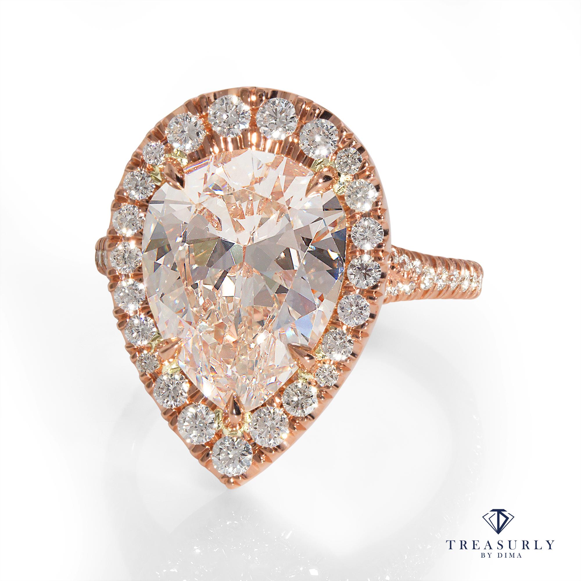 Elegant and Impressive, Timeless Micro Pave 14K Rose Gold Pave Halo PEAR shaped Diamond ring. 
The Center diamond is 5.09CT M, Faint Brown color, VS1 clarity GIA CERTIFIED. GREAT CUT and AMAZING BRILLIANCE!
The Diamond is Warm White with a slight