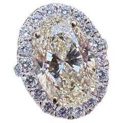 Bague halo de diamants jaunes brillants ovales de 6,05 carats certifiés GIA en or 18 carats