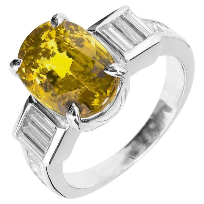 GIA 6.08 Carat Natural Oval Yellow Sapphire Diamond Platinum Engagement Ring For Sale