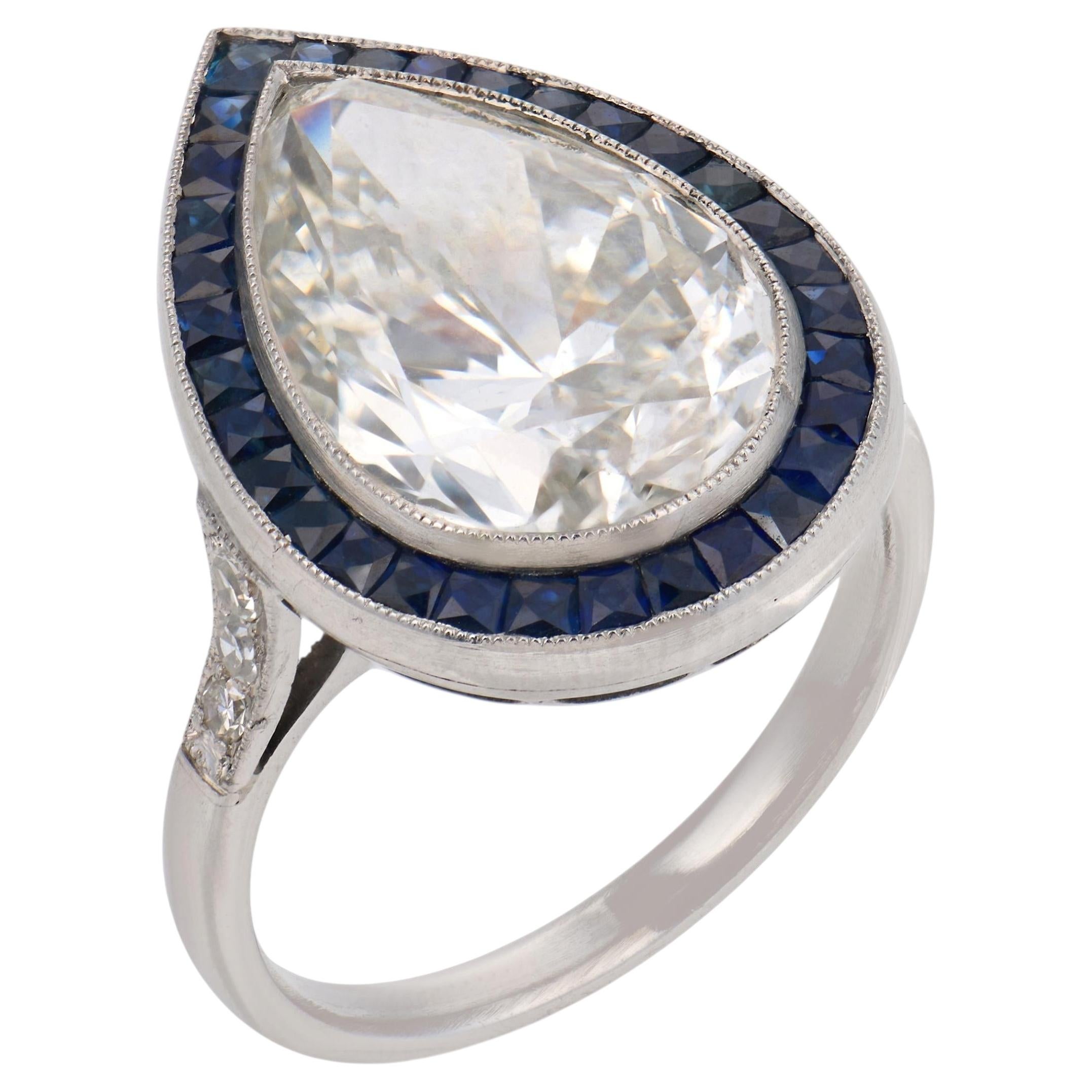 GIA 6.10 carat pear shape diamond sapphire platinum engagement ring