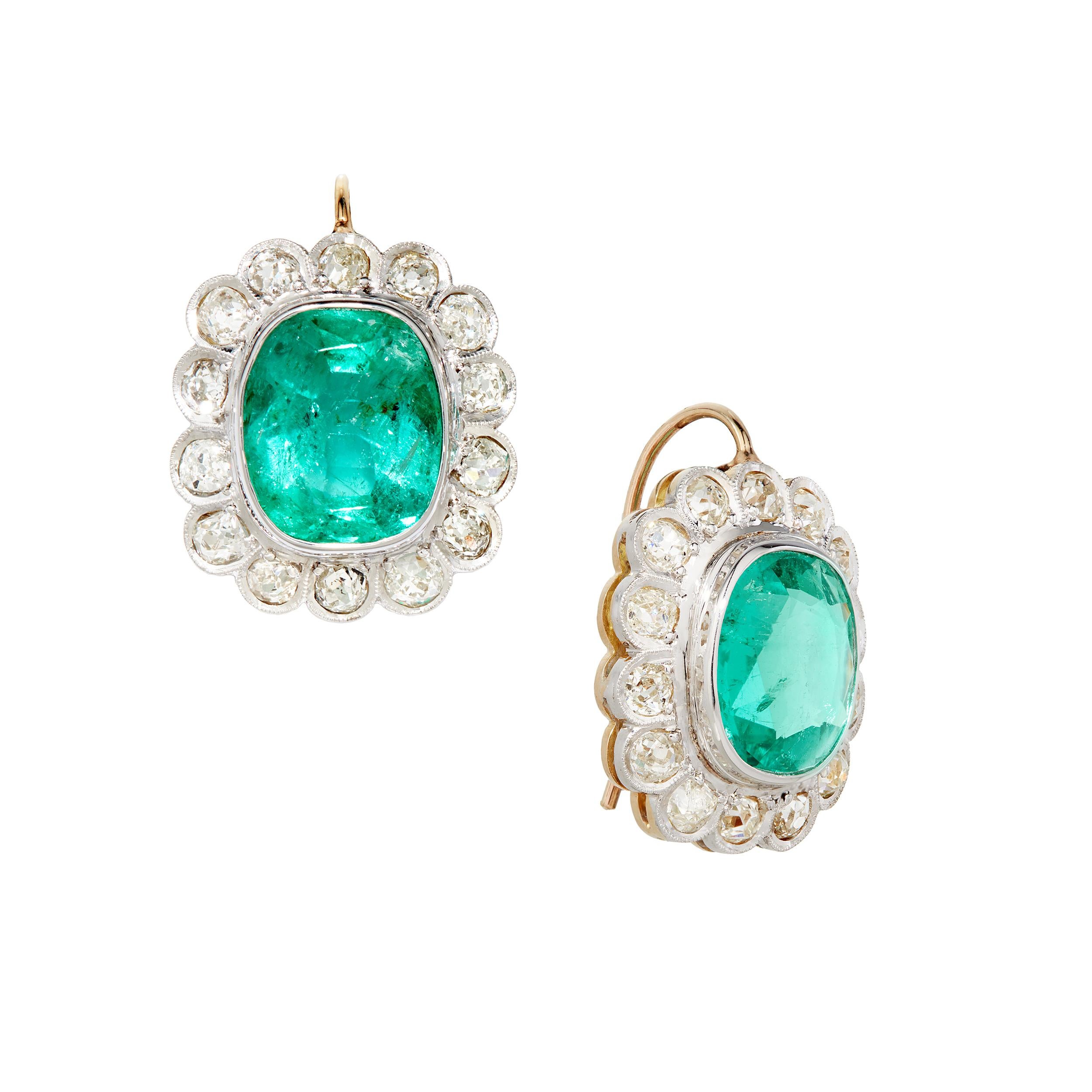 Gorgeous Colombian Emerald Earrings set in 18K Yellow Gold and Platinum.

Earring Details:

2 Colombian Cushion Cut Emeralds Weighing Approximately:  4.7 Carats 
28 Round Brilliant Diamonds Weighing Approximately:  1.40 Carats

Total Gem Weight