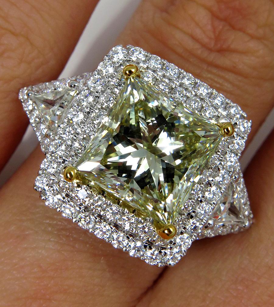 More rare than a colorless diamond, a fancy color diamond is truly the most brilliant and exotic stone that comes from the earth.
A gorgeous center natural fancy color diamond is ignited by bright white diamonds that shimmer with real sparkle and