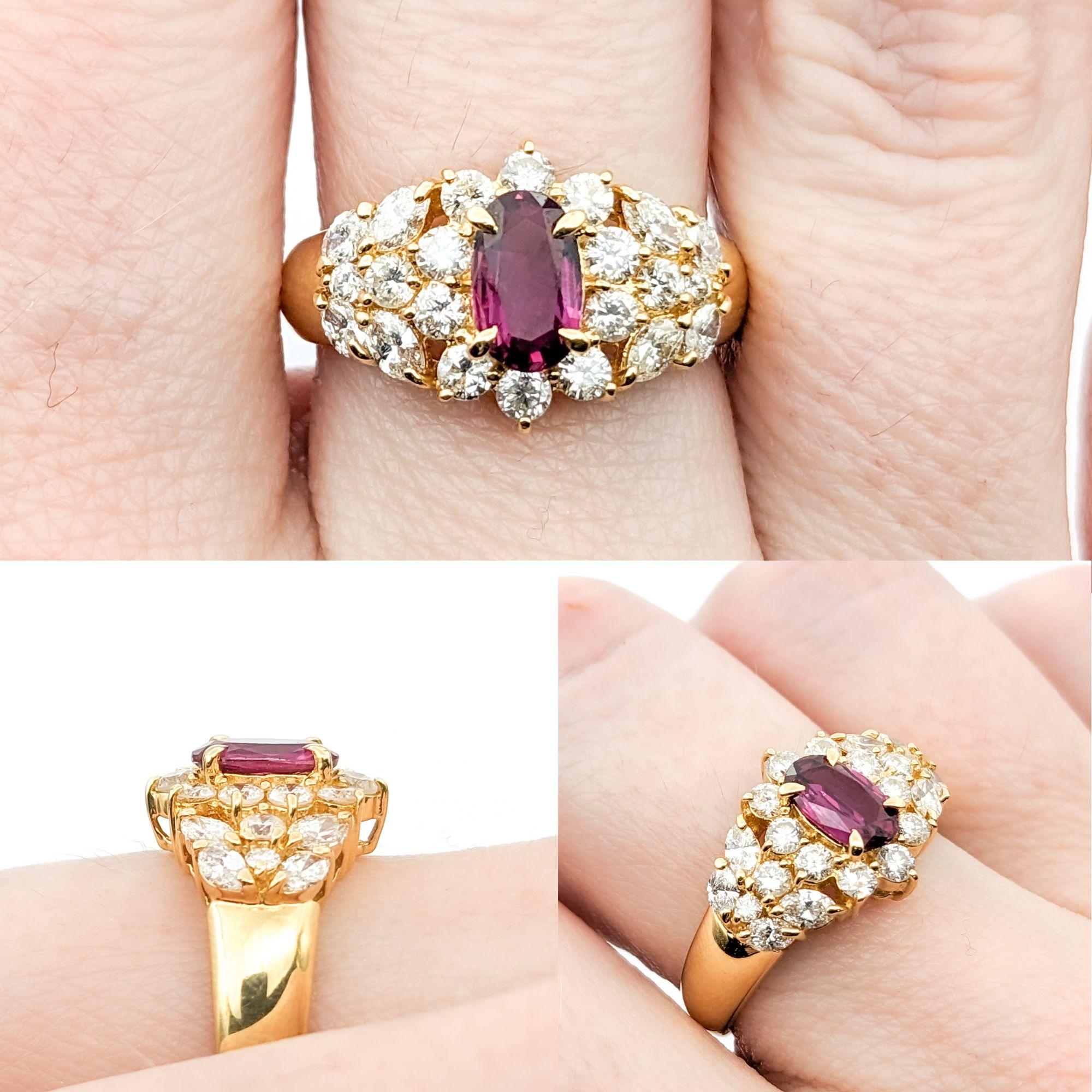GIA .68ct Ruby & Diamond Ring In Yellow Gold

This ring is a gorgeous piece crafted in 18kt yellow gold, centered around a stunning 0.68ct ruby. It is surrounded by 0.88ctw of round diamonds, which are of VS clarity and a near colorless white hue,