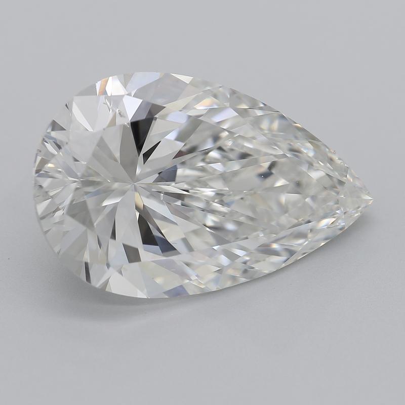 This sophisticated diamond ring features a striking centerpiece of a pear diamond, weighing 7.01 and boasting a rich H and SI2. Handcrafted with precision, the ring showcases a beautifully polished band in white gold , enhancing its luxurious