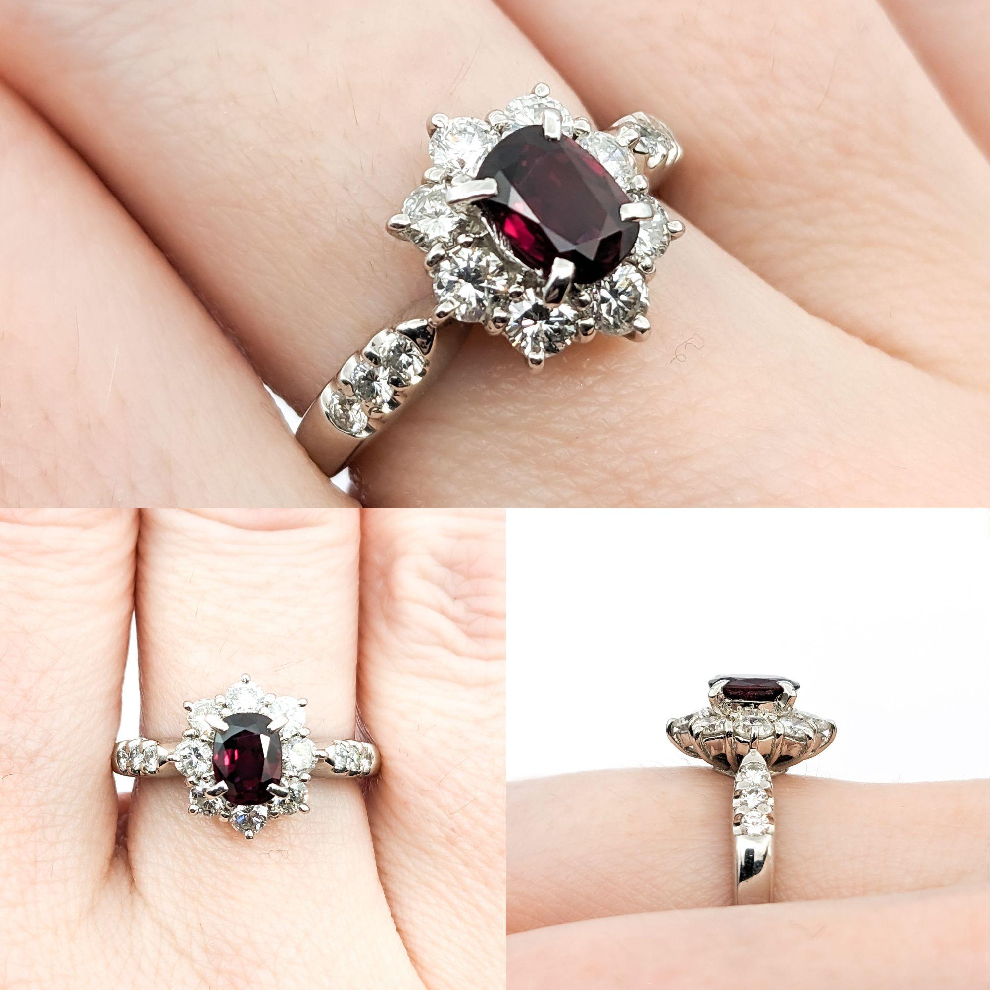 GIA .70ct Ruby & .82ctw Diamond Ring In Platinum

This ring, exquisitely crafted in 900 platinum, showcases a captivating 0.70ct ruby at its heart, encircled by 0.82ctw of round diamonds with SI clarity and a near colorless white hue. The
