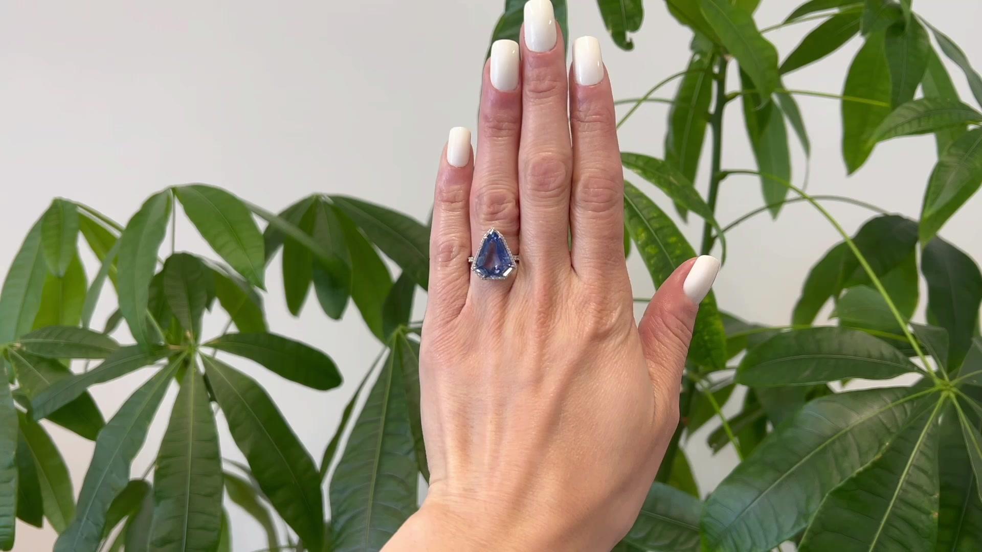 One GIA 7.41 Carats Ceylon Sapphire Diamond Platinum Ring. Featuring one GIA shield cut sapphire of 7.41 carats, accompanied with GIA stating the sapphire is of Ceylon (Sri Lanka) origin. Accented by 75 round brilliant cut diamonds with a total