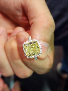 GIA 7.56 Carat Fancy Yellow Cushion Diamond Ring in White Gold