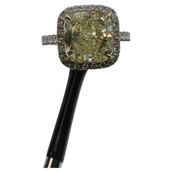 A Cushion Diamond Fancy Yellow Color of 7.56 Carat set around colorless Diamonds to create an impressive ring. GIA Certified centerstone sparkles set around 47 small round cut diamonds. Dress to impress with this iconic ring!

Do you have a question
