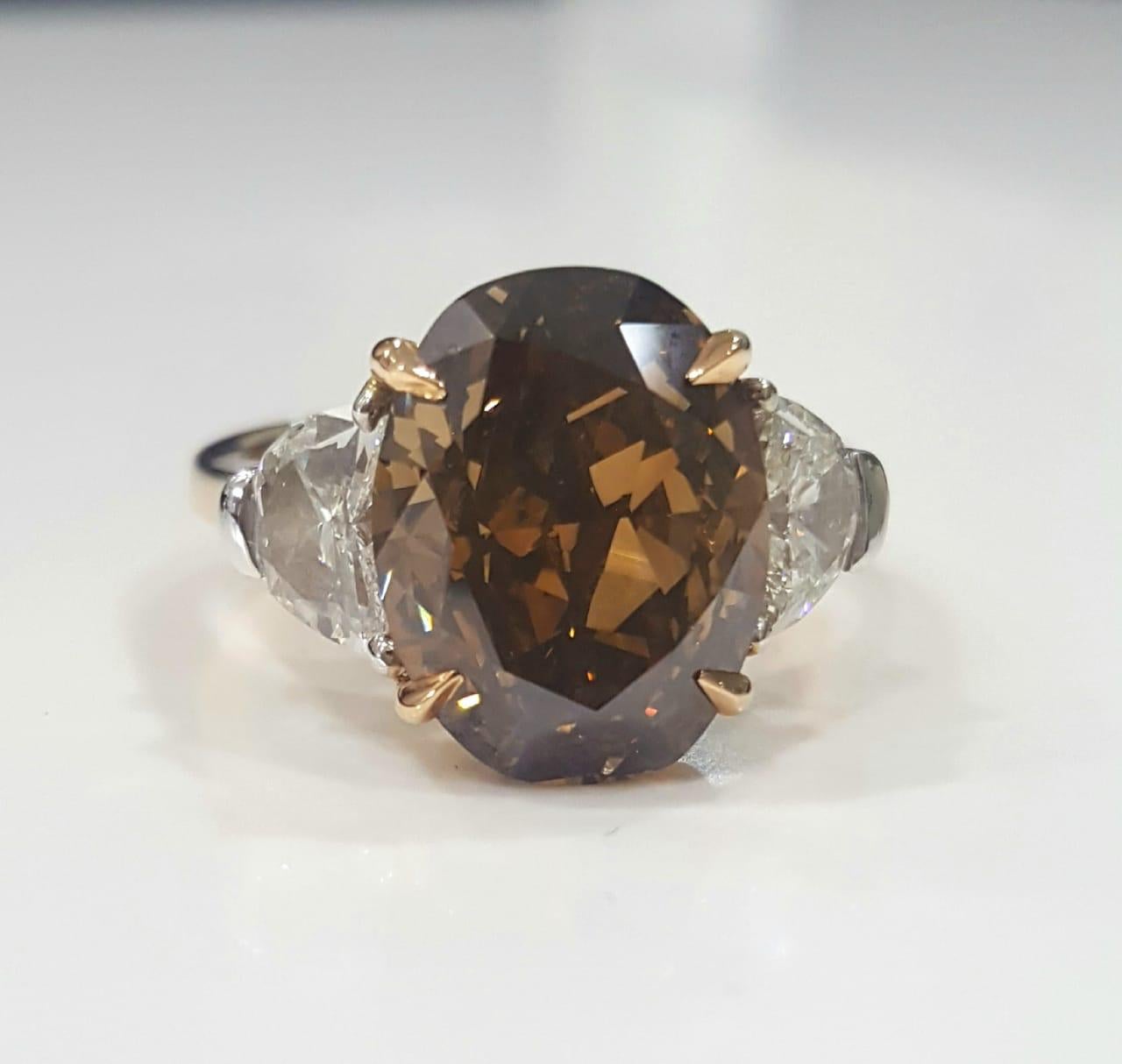 GIA 7.97 Carat Natural Fancy Dark Orange Brown Oval brilliant Diamond Ring. For Sale 2