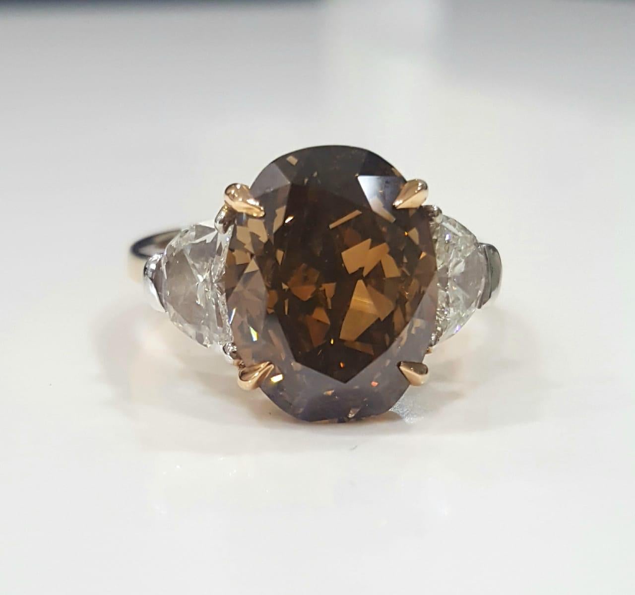 GIA 7.97 Carat Natural Fancy Dark Orange Brown Oval brilliant Diamond Ring. For Sale 3