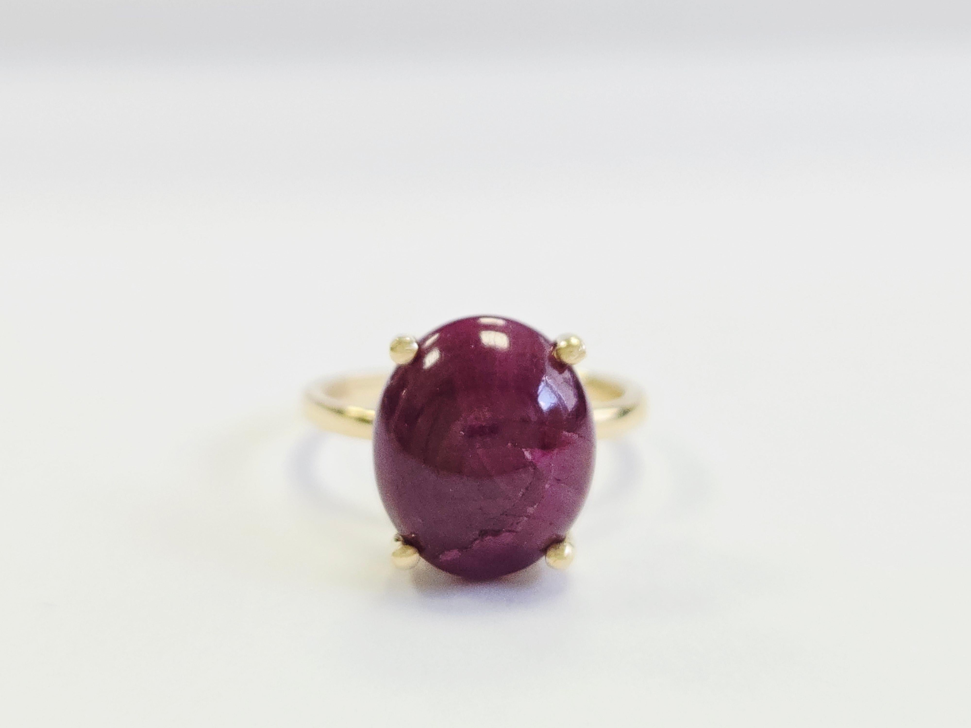 GIA 8.02 Carat Cabochon Ruby Ring in 14K Yellow Gold

Timeless elegance meets exceptional craftsmanship in this striking GIA-certified 8.02-carat cabochon ruby ring, exquisitely set in warm 14 karat yellow gold. The centerpiece is a richly colored