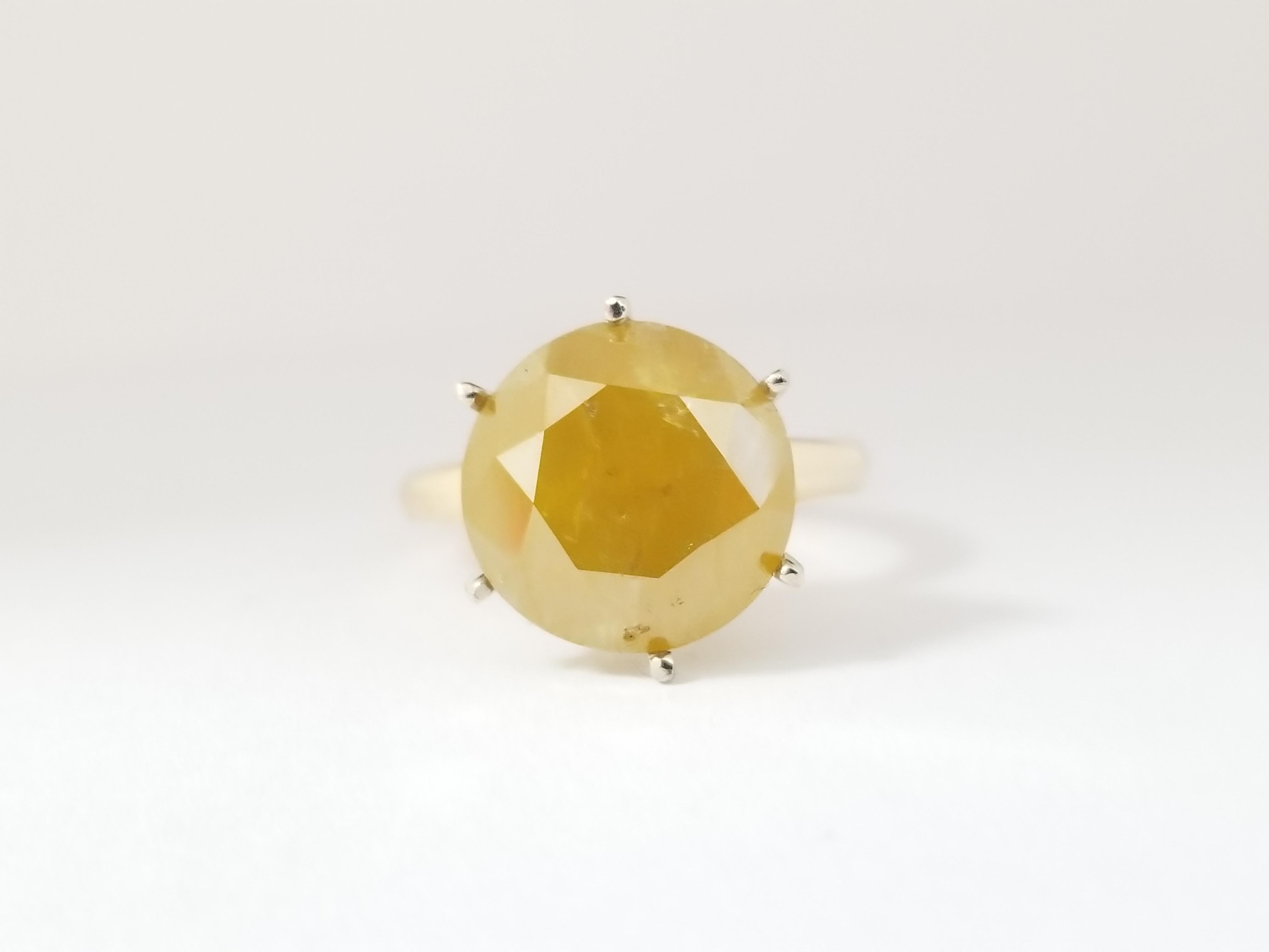 GIA Natural fancy deep brownish yellow round diamond weighing 8.17 carats. 6 prong solitaire set on 14K yellow gold.
Ring size: 7