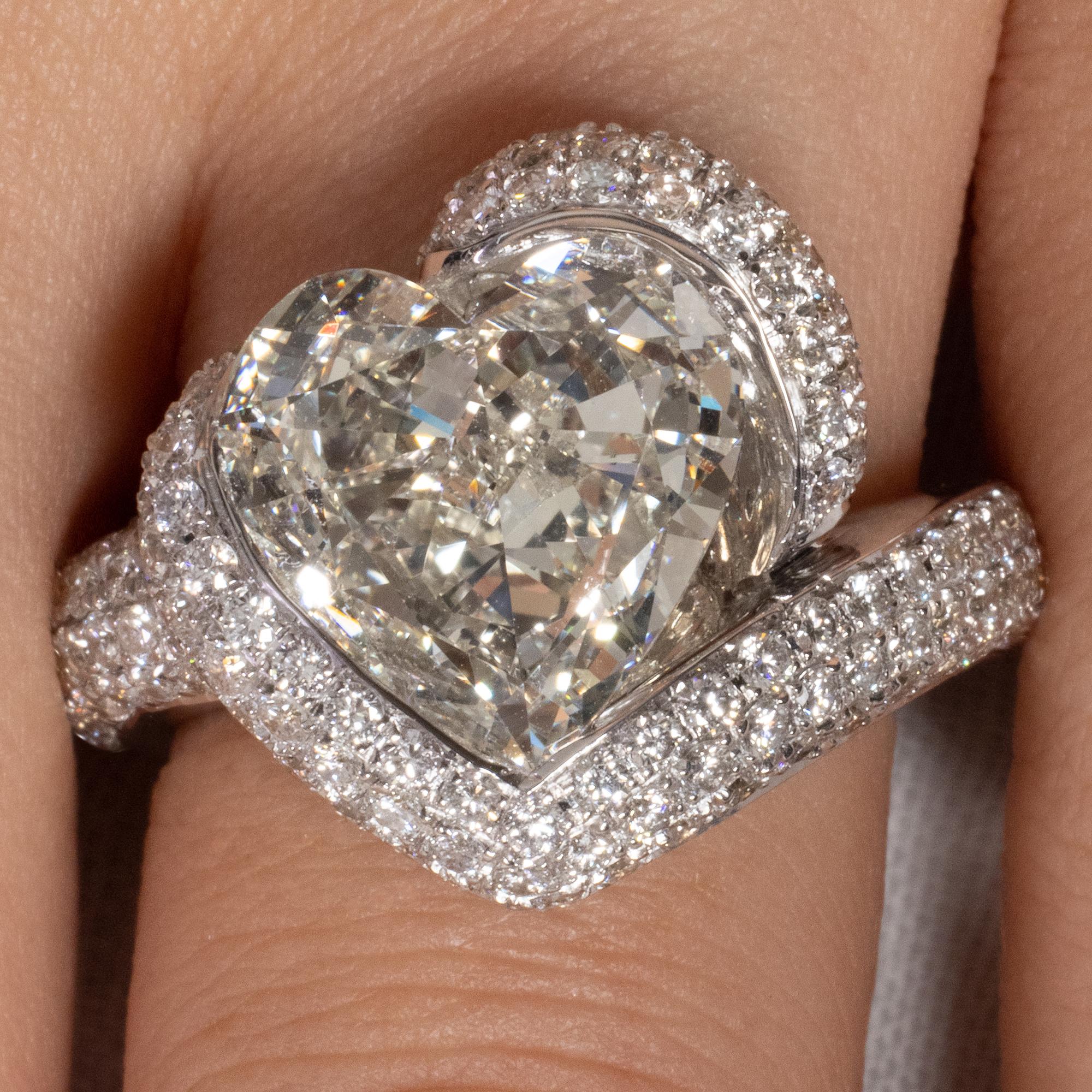 Gorgeous Timeless 18k White Gold (stamped) Heart Diamond Engagement Anniversary or Right Hand Ring. The Center Stone is GIA Certified 5.01ct Natural Heart Shaped Diamond, in M color and VS1 clarity; with measurements of 12.07x12.01x5.50mm. GIA