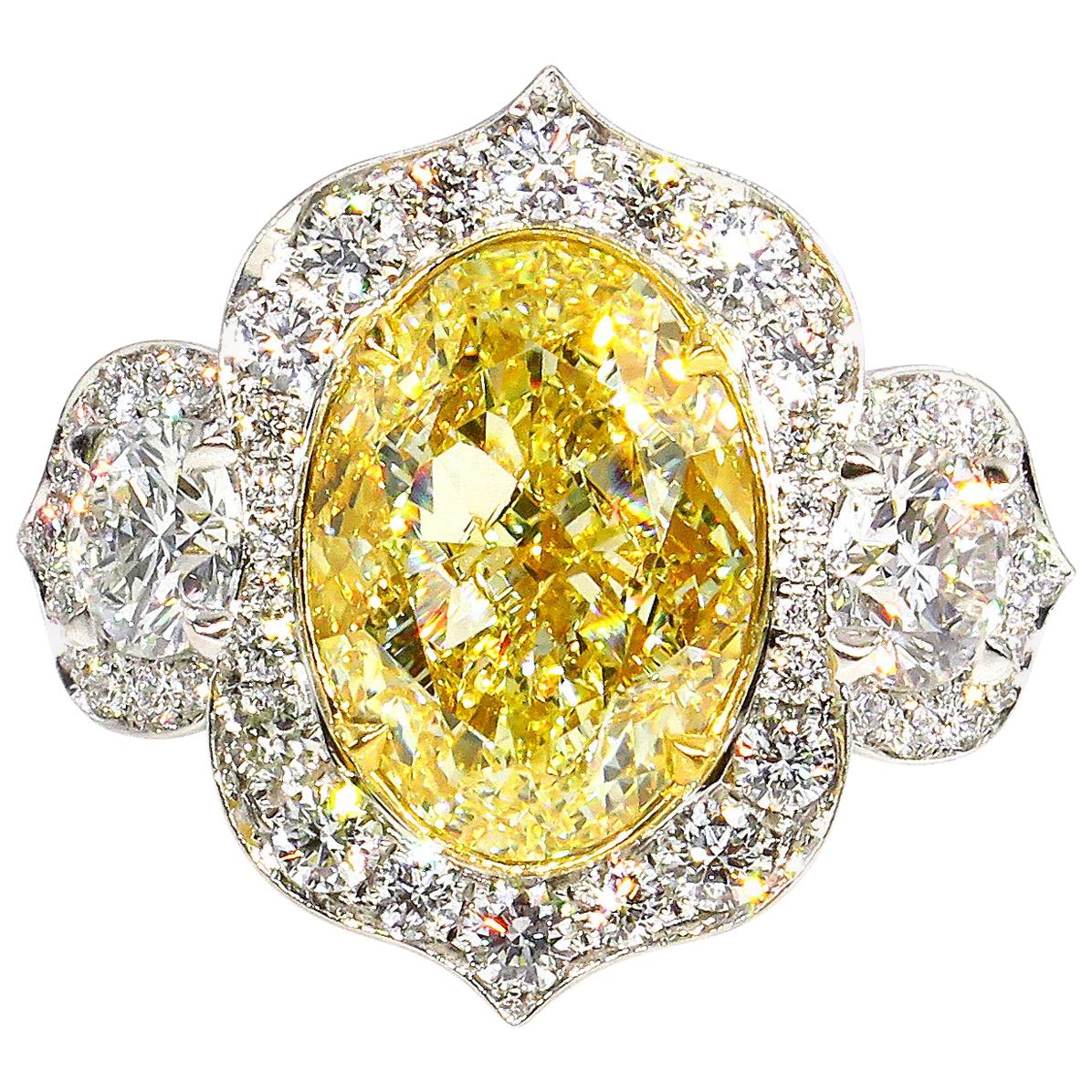 GIA 8.22 Carat Fancy Yellow Oval Diamond 3-Stone Engagement Platinum Ring