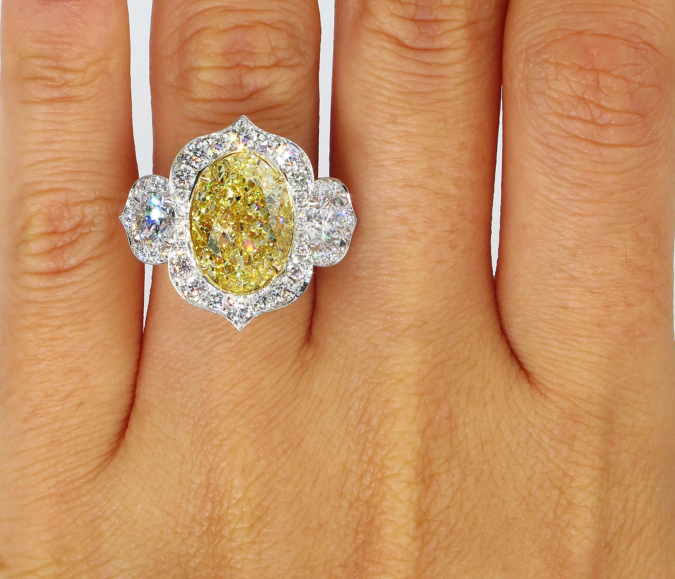 GIA 8.22 Carat Fancy Yellow Oval Diamond 3-Stone Engagement Platinum Ring 4
