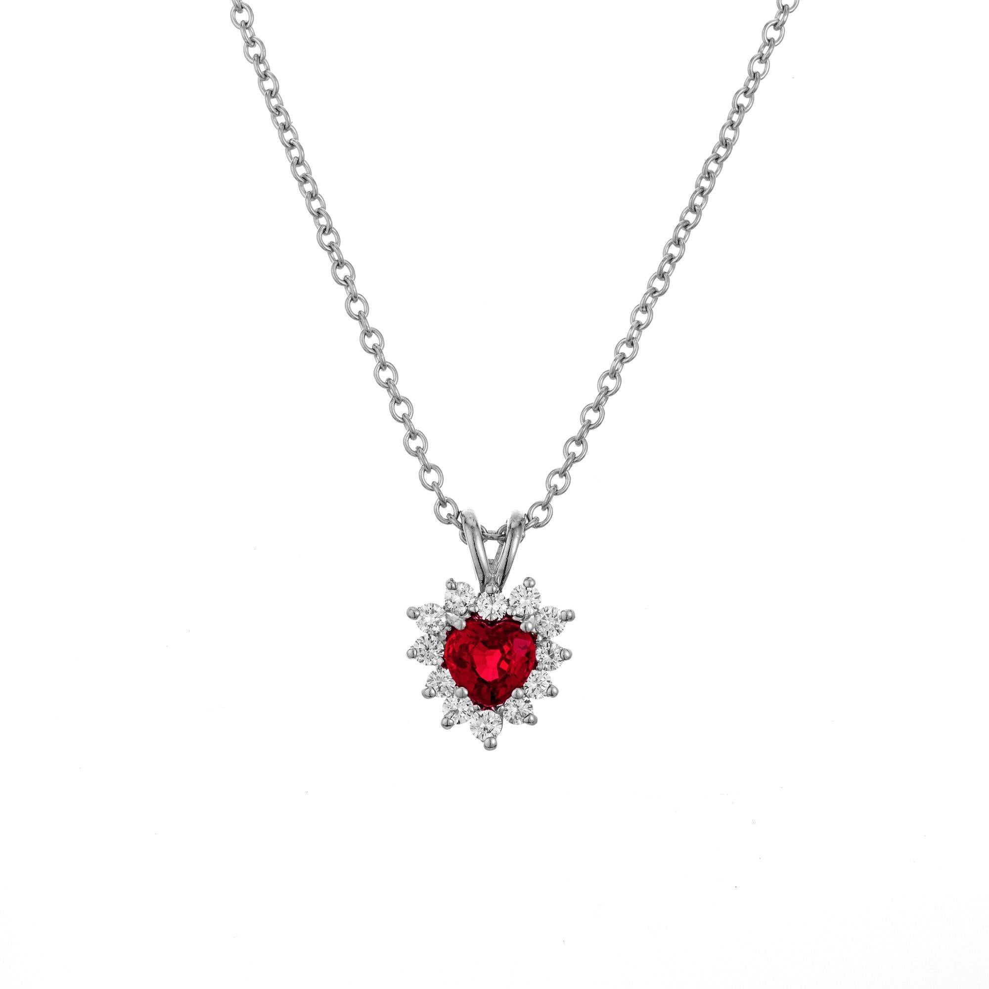 Ruby and diamond pendant necklace. This piece begins with a heart shaped ruby mounted in a platinum setting with a halo of  11 round brilliant cut diamonds. GIA has certified the ruby as simple heat with minor residue. An 18 inch platinum chain. 

1