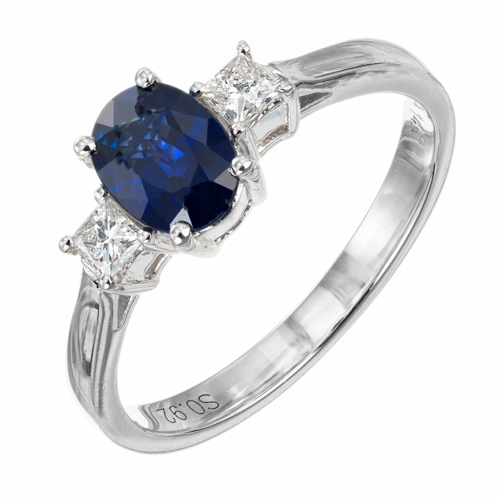 Oval and diamond engagement ring. GIA certified Natural no heat Royal blue center sapphire, with 2 princess cut side diamonds in a  14k white gold three-stone setting.  

1 GIA certified #2145648629 natural no heat oval Sapphire 6.8 x 5.10 x 3.20mm,