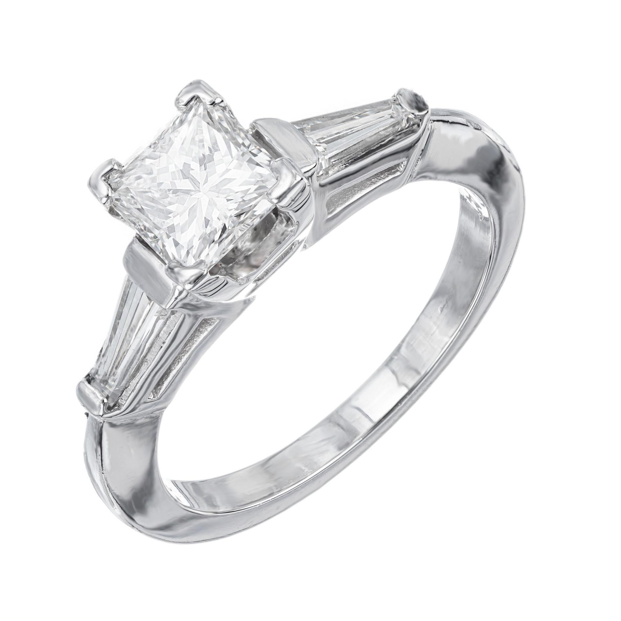 Diamond engagement ring. GIA certified .99ct princess cut diamond set in a platinum three stone simple setting, accented with 2 tapered baguette side diamonds. The center diamond is graded by the GIA as G (near colorless) and has great sparkle.