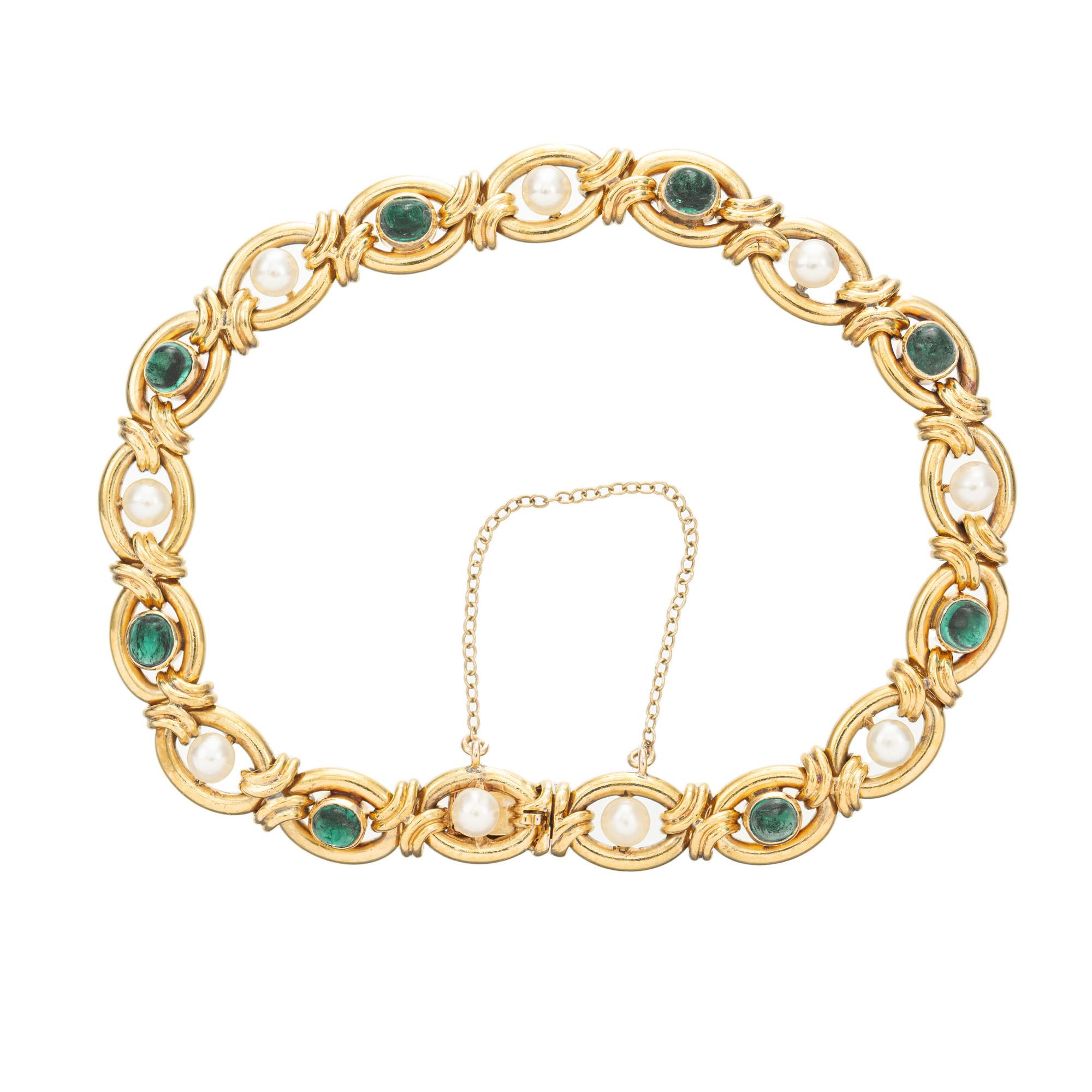 1910-1920 Antique emerald and pearl hand crafted natural patina 14k yellow gold link bracelet. This unique bracelet begins with 8 AGL certified oval cabochon emeralds alternating with 9 GIA certified natural saltwater pearls. The emeralds are