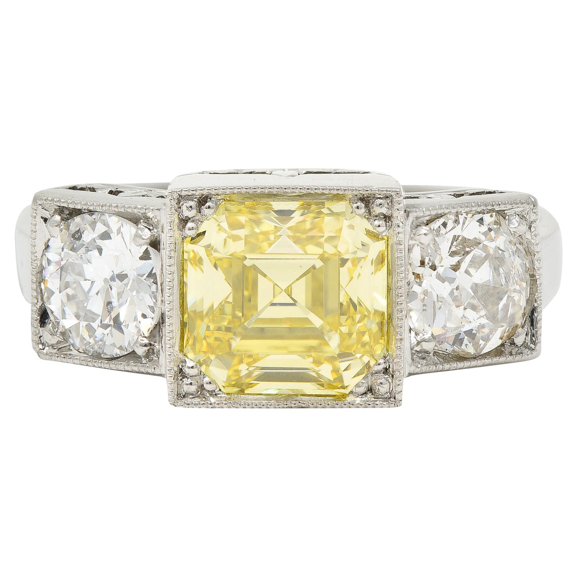 GIA Art Deco 3.20 Carats Asscher Cut Fancy Intense Yellow Diamond Platinum Ring For Sale