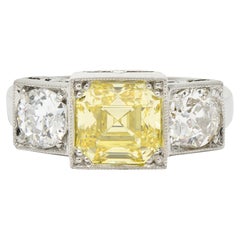 Vintage GIA Art Deco 3.20 Carats Asscher Cut Fancy Intense Yellow Diamond Platinum Ring