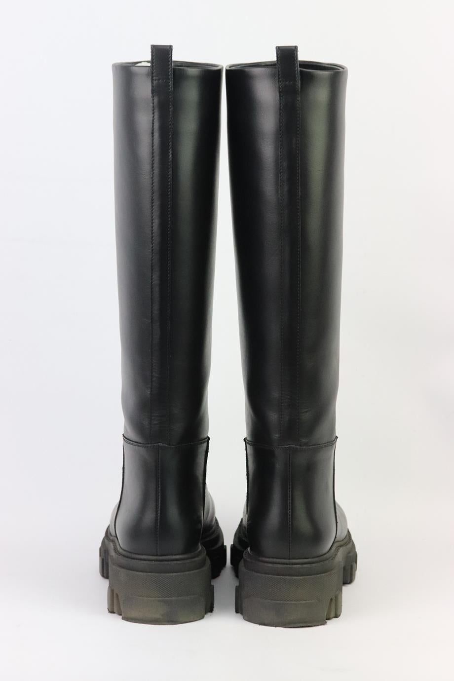 These ‘Perni 07’ boots by GIA BORGHINI in collaboration with Pernille Teisbaek are made from smooth leather and features knee-high shafts and sturdy, combat-inspired soles. Heel measures approximately 50 mm/ 2 inches. Black leather. Pull on. Comes