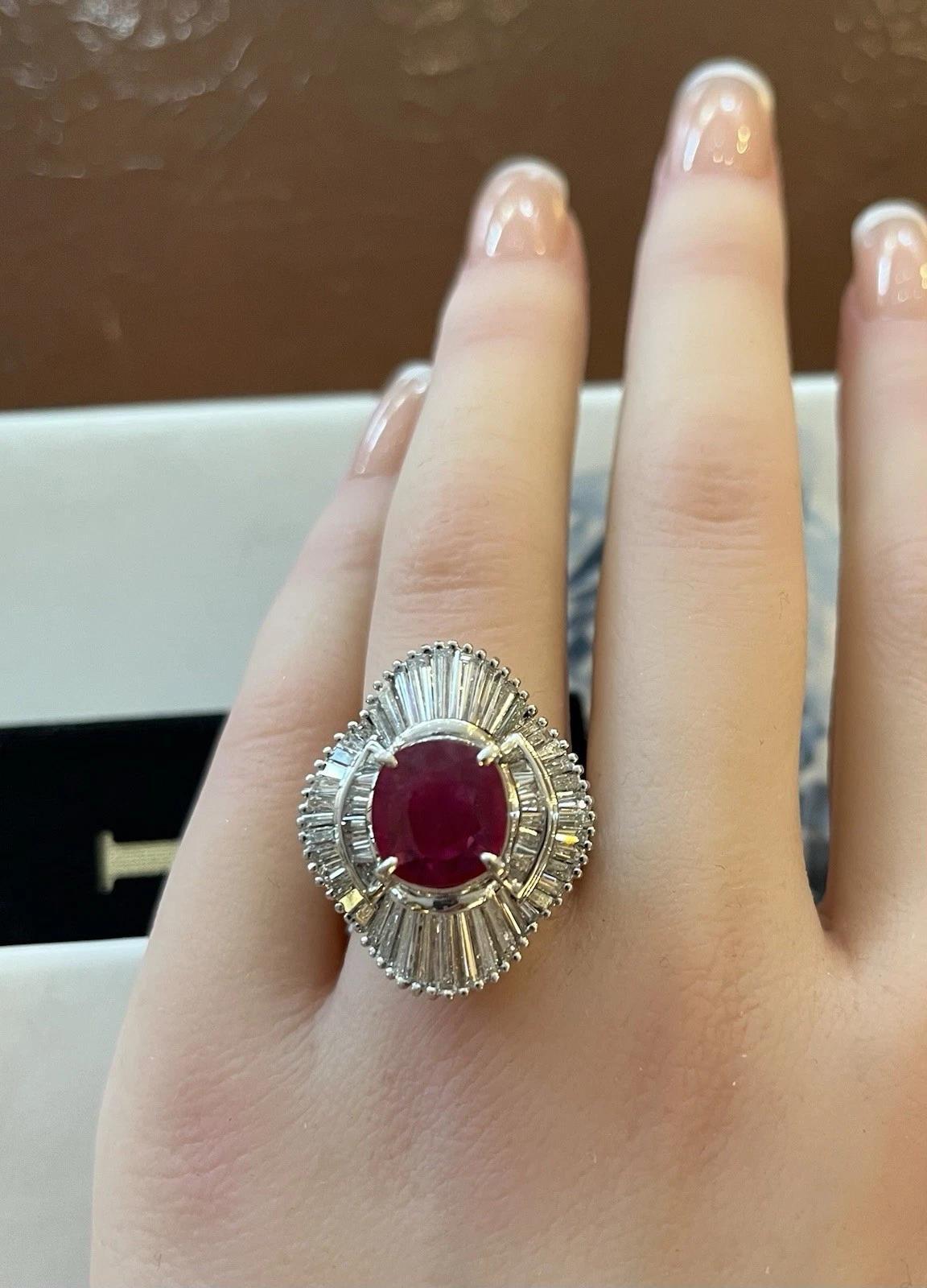 GIA Burma Heated Ruby 3.43 ct Oval in Diamond Platinum Ring

Ruby and Diamond Ring features a GIA certified 3.43 carat Burma Ruby surrounded by Baguette Diamonds in a Platinum Ballerina setting.

Total ruby weight is 3.439 carats and is GIA