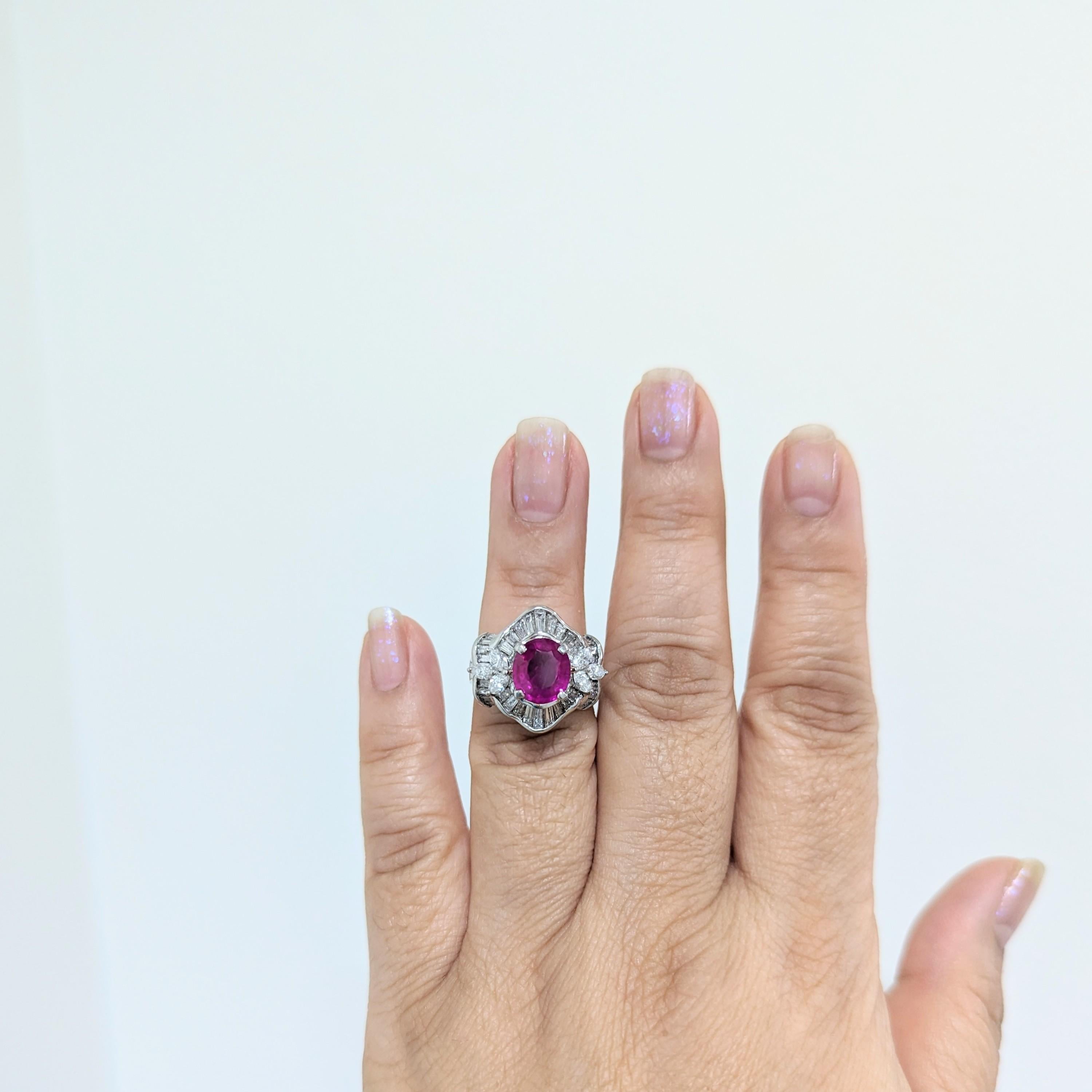 Beautiful 2.78 ct. Burma purplish red ruby oval with GIA certificate and 2.62 ct. good quality white diamond marquise shapes and baguettes.  Handmade in platinum.  Ring size 6.25.  GIA certificate included.
