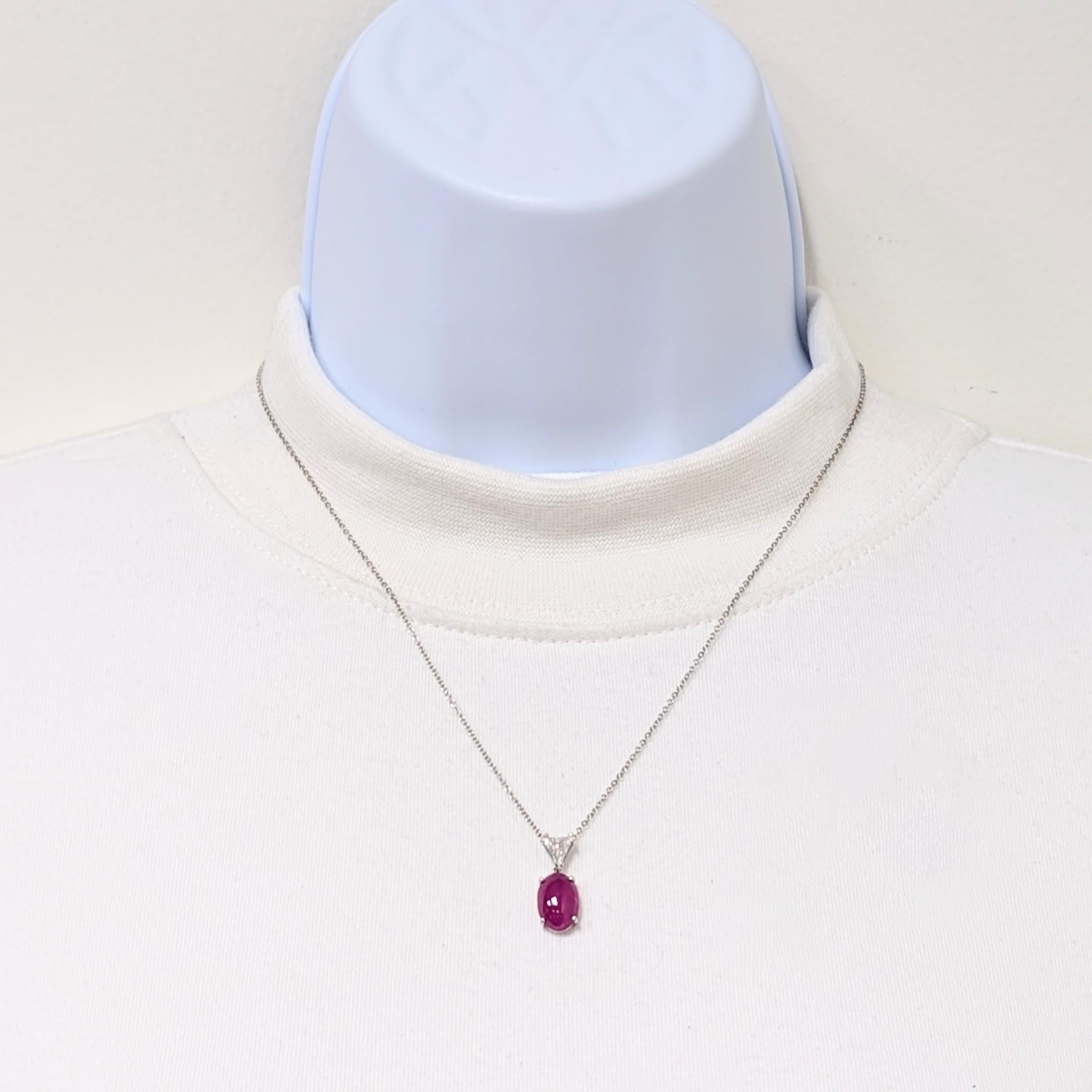 Gorgeous GIA 4.43 ct. purplish red ruby oval cabochon with 0.35 ct. good quality white diamond trillion.  Handmade in platinum.  Length is 18