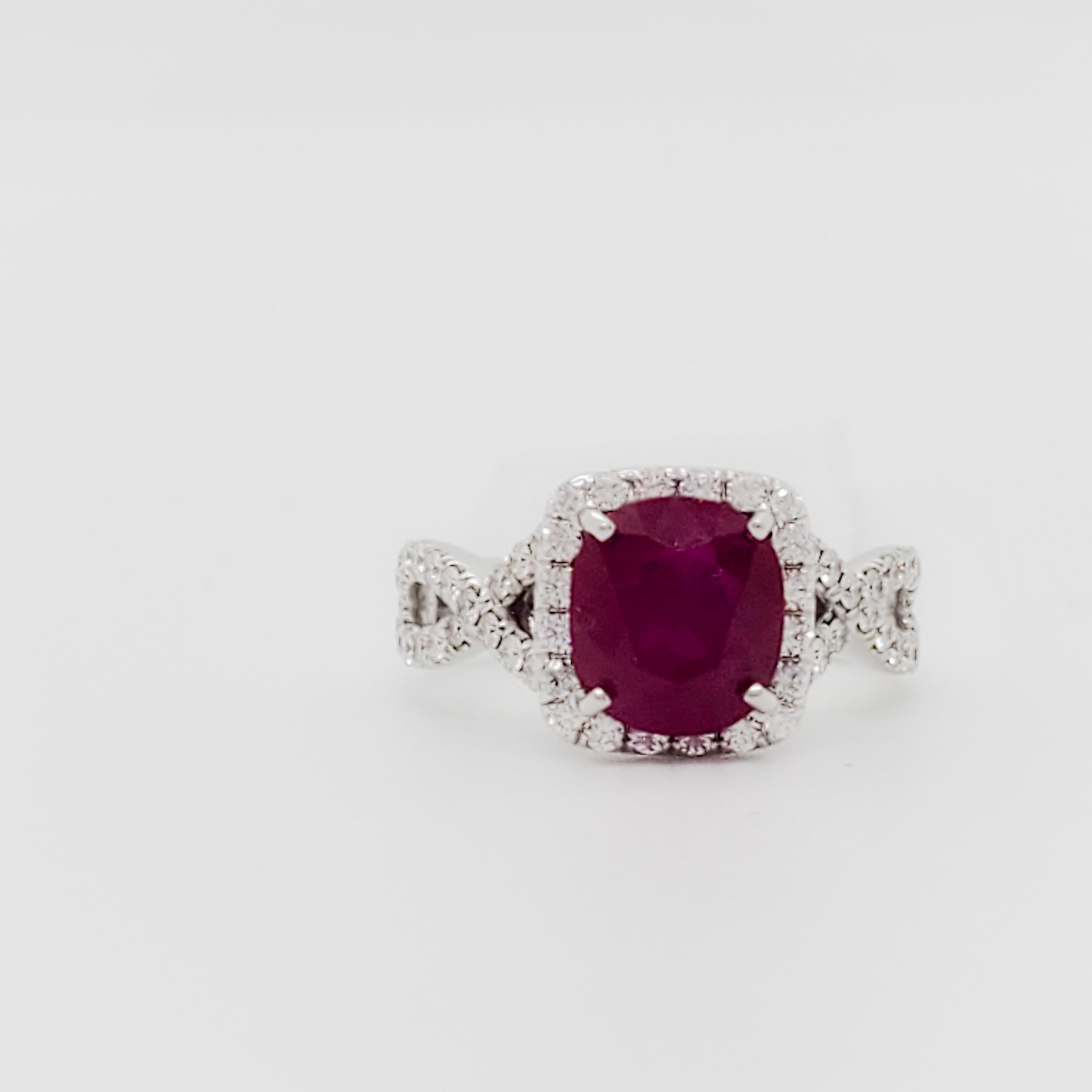 Gorgeous 2.15 ct. Burma ruby cushion with 0.50 ct. good quality white diamond rounds.  Handmade in 18k white gold.  Ring size is 4.75.  The braided pave band adds a very feminine touch to the ring. 
GIA certificate is included.